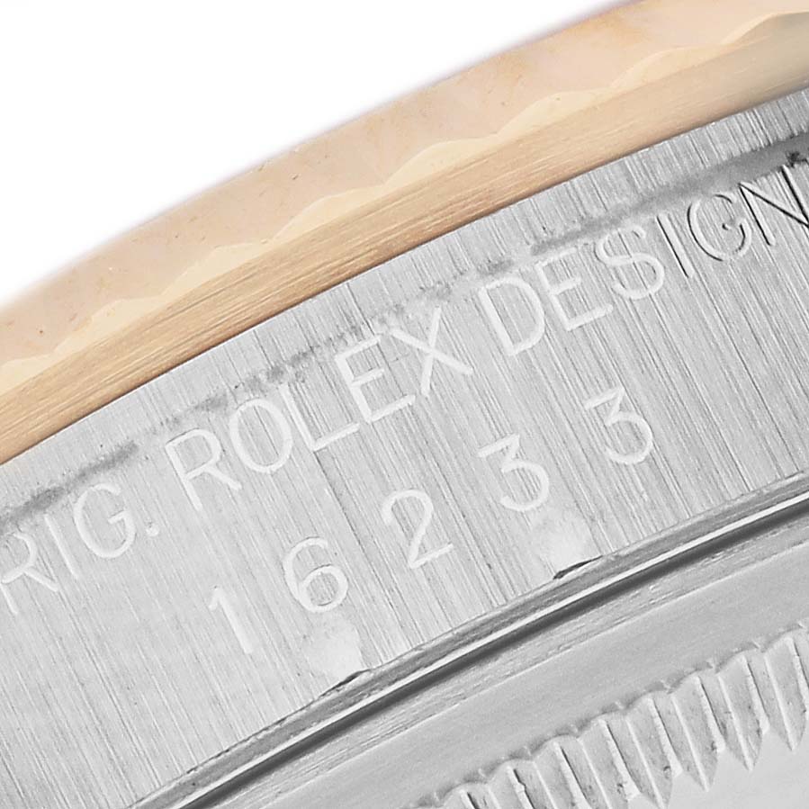 The image shows a close-up of the engraved side of a Rolex Datejust 16233 Men's Steel and Gold (two tone) White Dial 16233 Men's Steel and Gold (two tone) White Dial bezel, focusing on the model number.