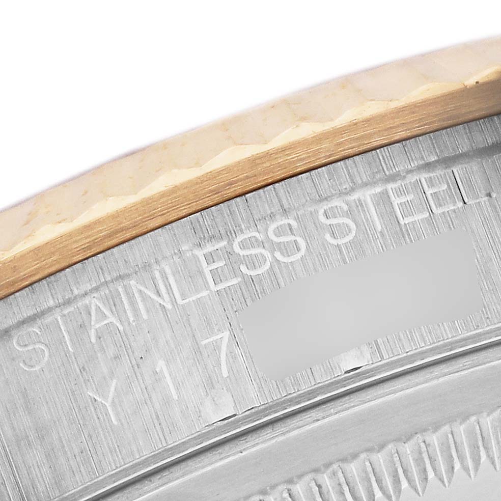 The image shows a close-up of a Rolex Datejust 16233 Men's Steel and Gold (two tone) White Dial 16233 Men's Steel and Gold (two tone) White Dial model featuring the fluted bezel and part of the case.