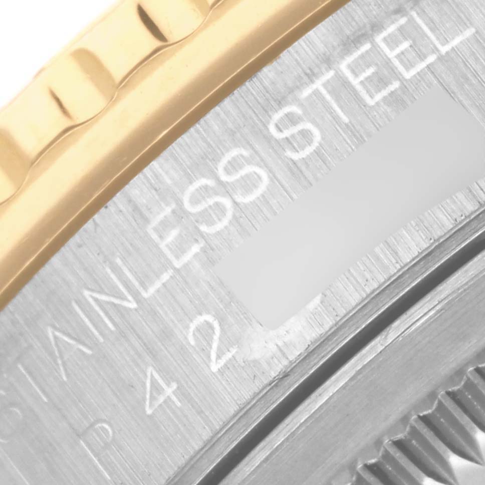 The image shows a close-up of the bezel and edge of the case back of a Rolex Turn-o-Graph 16263 Men's Steel and Gold (two tone) White Dial 16263 Men's Steel and Gold (two tone) White Dial, highlighting "Stainless Steel" text.
