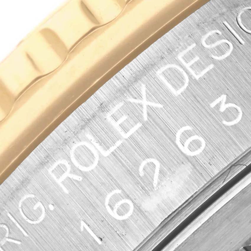 The image shows a close-up of the Rolex Turn-o-Graph 16263 Men's Steel and Gold (two tone) White Dial 16263 Men's Steel and Gold (two tone) White Dial model's bezel and engraved side, highlighting the brand name.