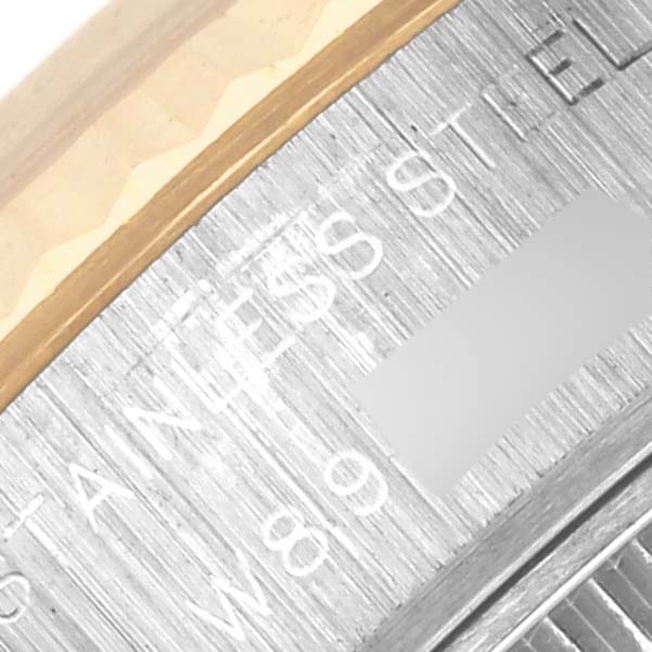 The close-up image shows the edge of the bezel and part of the engraved text on a Rolex Datejust 69173 Women's Steel and Gold (two tone) White Dial 69173 Women's Steel and Gold (two tone) White Dial watch.