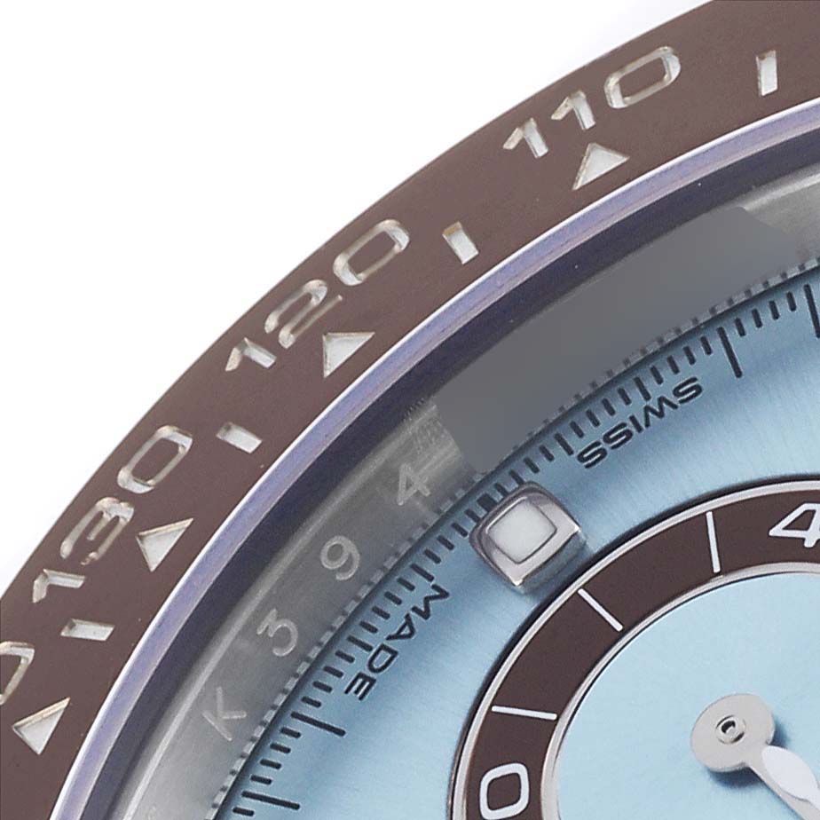 The image shows a close-up of the bezel and dial of a Rolex Daytona 116506 Men's Platinum Blue Dial 116506 Men's Platinum Blue Dial watch, highlighting the numbers and part of the sub-dial.