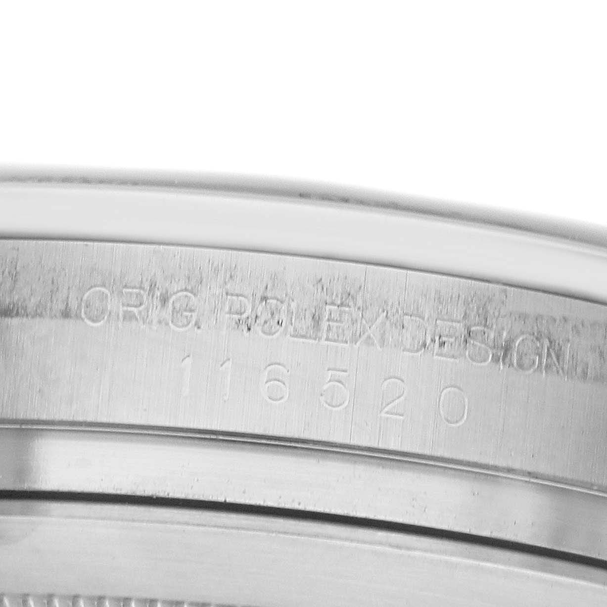 The image shows a close-up of the case edge of a Rolex Daytona 116520 Men's Stainless Steel White Dial, displaying engraved model details.