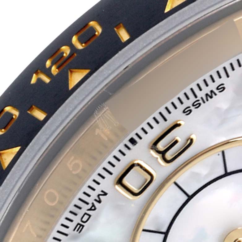 The image shows a close-up of the bezel and part of the dial of a Rolex Daytona 116518LN Men's Yellow Gold Mother of Pearl Dial 116518LN Men's Yellow Gold Mother of Pearl Dial watch, highlighting the numbers and markers.