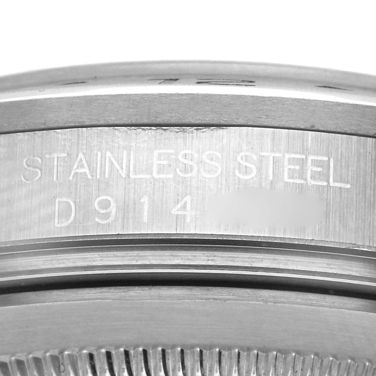 The image shows a close-up of the stainless steel casing with the serial number of a Rolex Explorer 16570T Men
s Stainless Steel Black Dial 16570T Men
s Stainless Steel Black Dial.
