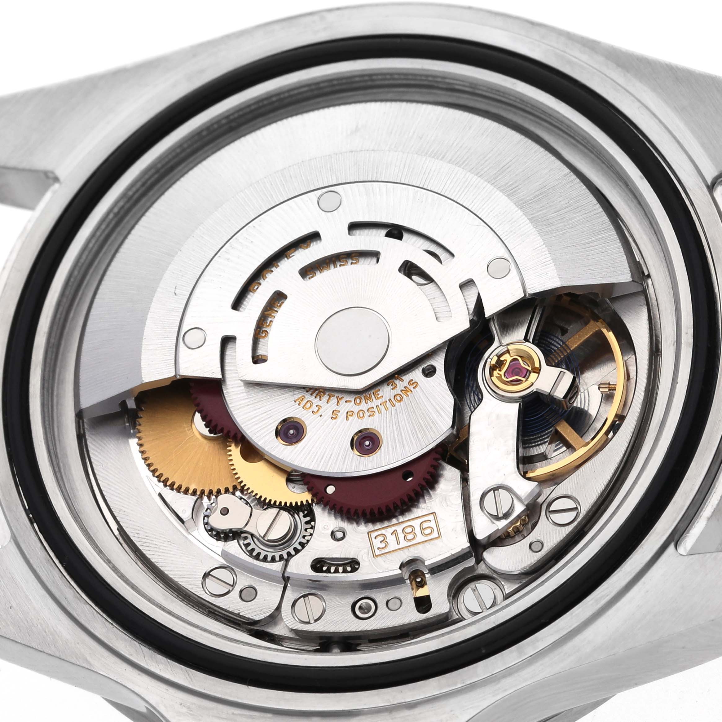 The image shows the movement of a Rolex Explorer 16570T Men's Stainless Steel Black Dial 16570T Men's Stainless Steel Black Dial watch from a rear angle, displaying its intricate internal components.