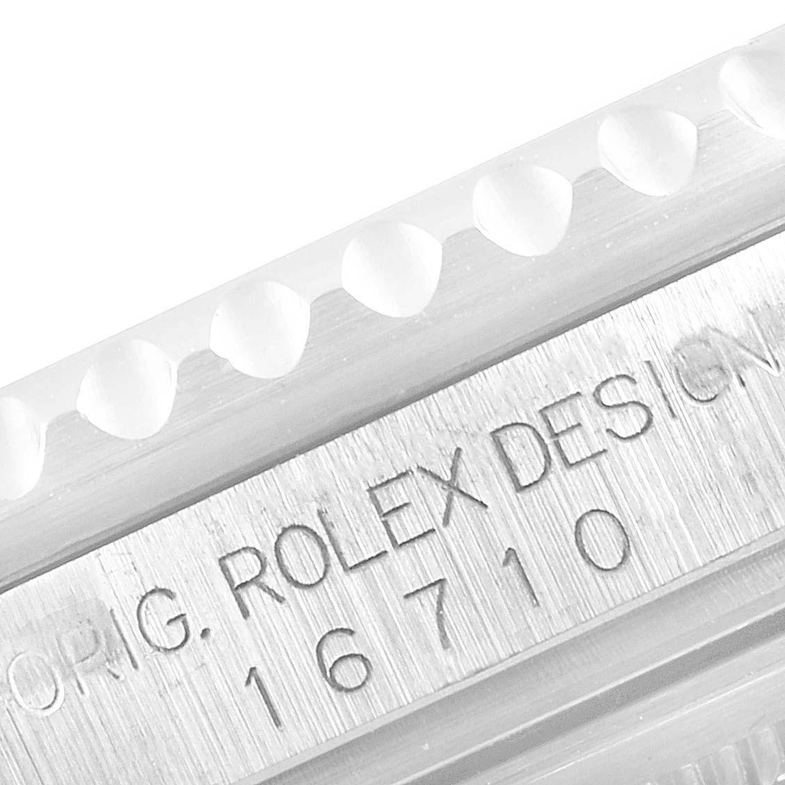 This close-up image shows the side of a Rolex GMT-Master 16710 Men
s Stainless Steel Black Dial 16710 Men
s Stainless Steel Black Dial watch, revealing the engraved model number 16710.