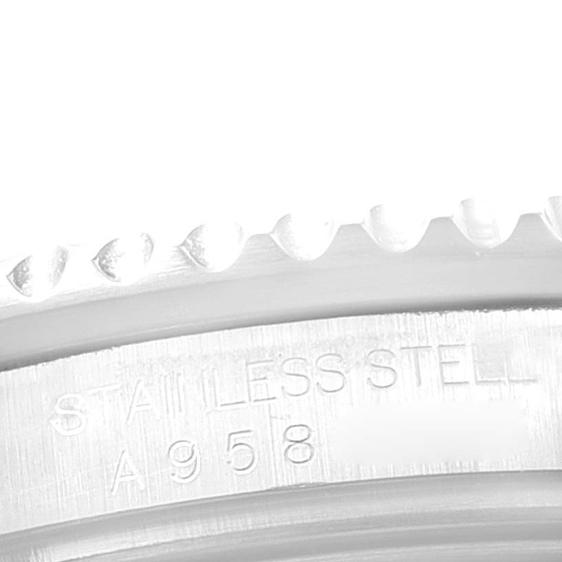 The image shows a close-up of the bezel and engraved case side of a Rolex GMT-Master 16710 Men
s Stainless Steel Black Dial 16710 Men
s Stainless Steel Black Dial watch, highlighting the "STAINLESS STEEL" marking.