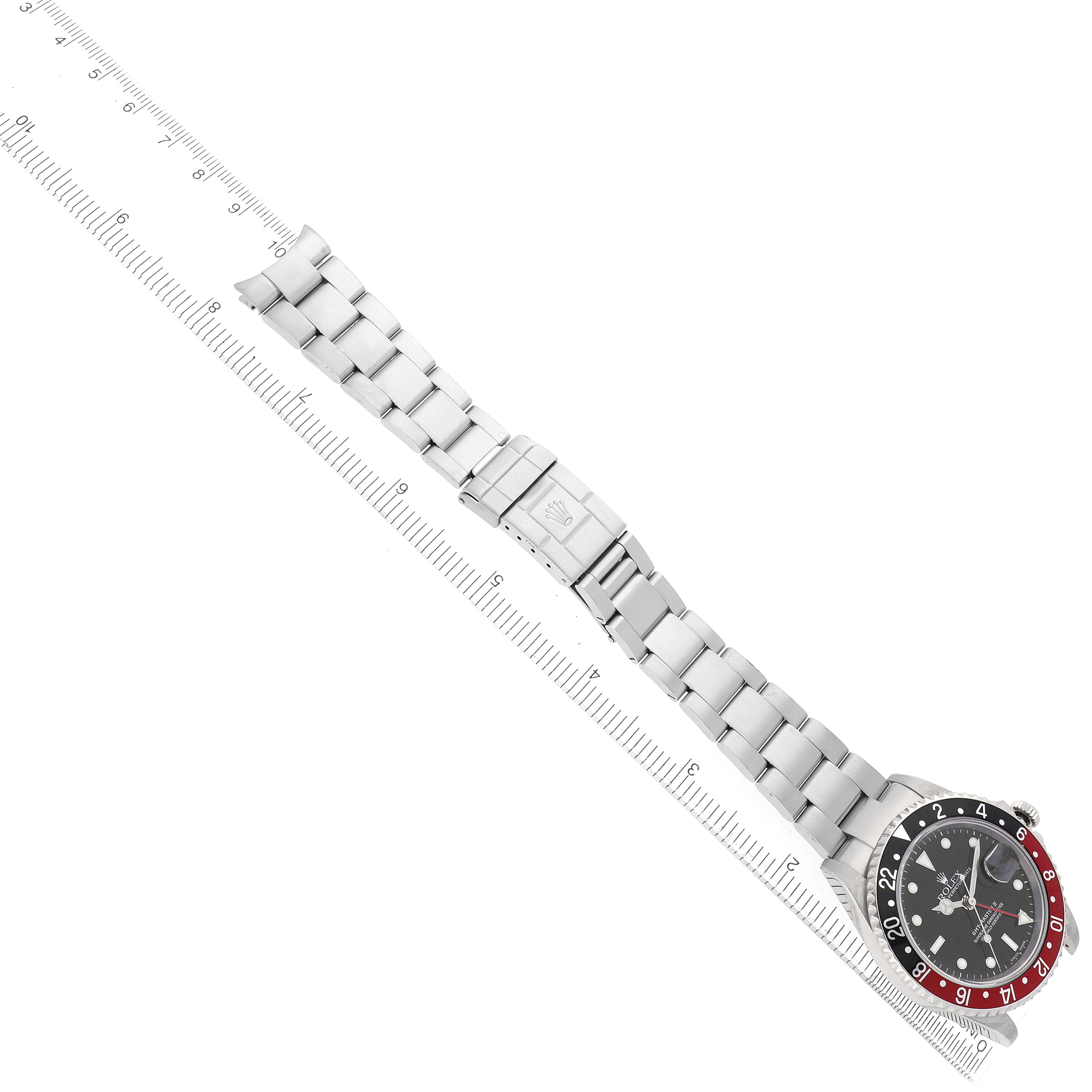 The Rolex GMT-Master 16710 Men's Stainless Steel Black Dial watch is shown from a top-down angle, displaying the full bracelet, clasp, and bezel.