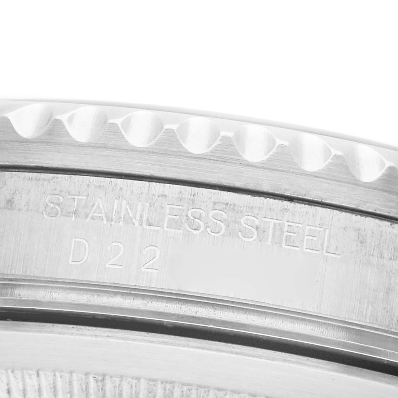 The image shows a close-up of the side of a Rolex GMT-Master 16710 Men's Stainless Steel Black Dial watch, highlighting the stainless steel bezel with engraved text.