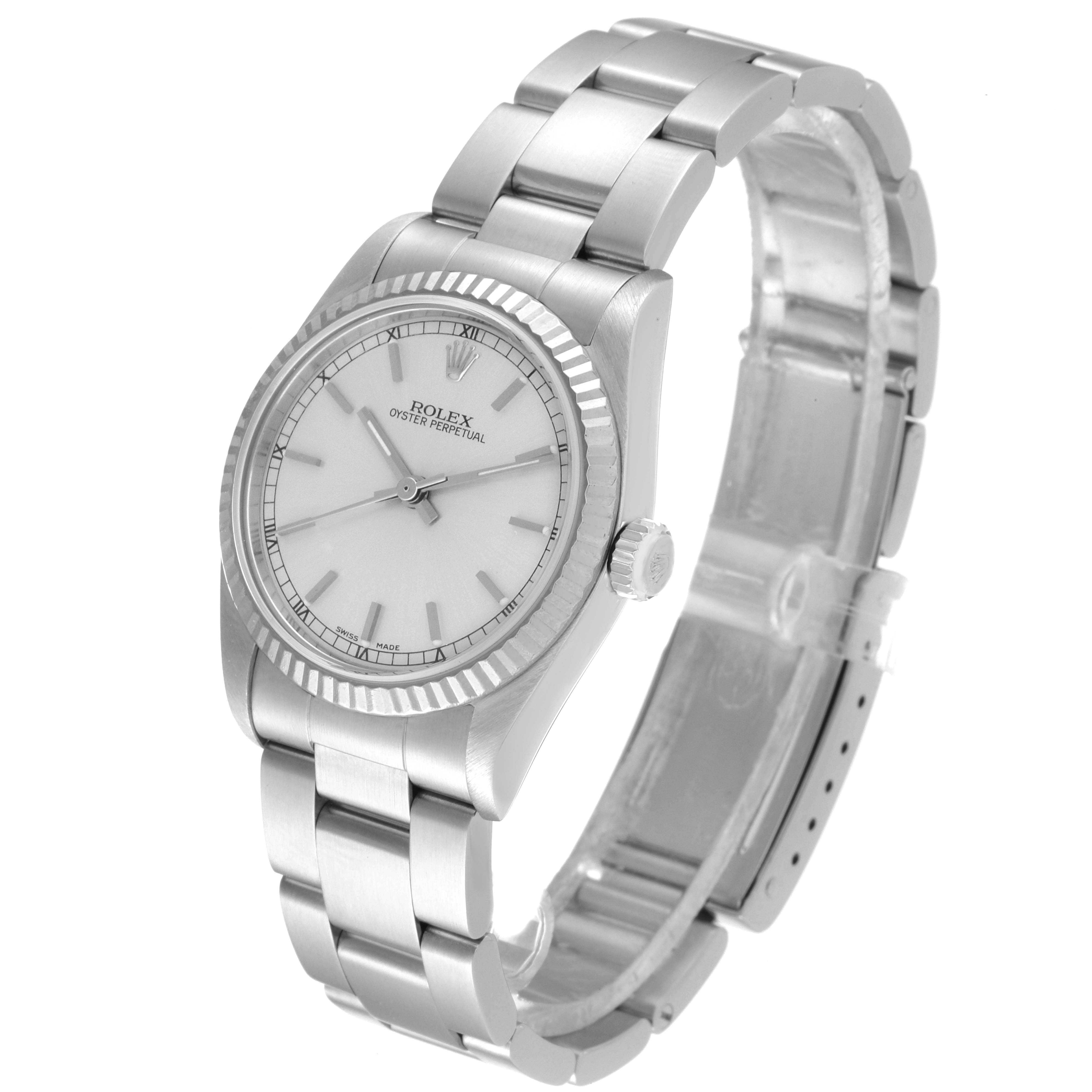 The image shows a Rolex Mid-Size 77014 Women
s Stainless Steel Silver Dial 77014 Women
s Stainless Steel Silver Dial Oyster Perpetual watch angled slightly from the side, displaying the dial, bezel, crown, and bracelet.