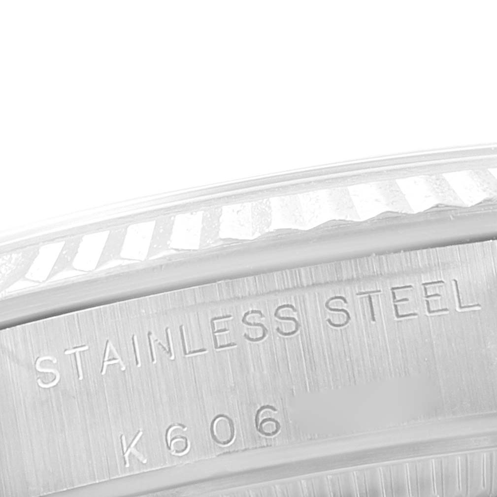 This close-up angle of the Rolex Mid-Size 77014 Women
s Stainless Steel Silver Dial 77014 Women
s Stainless Steel Silver Dial model shows the stainless steel case with engraved markings.