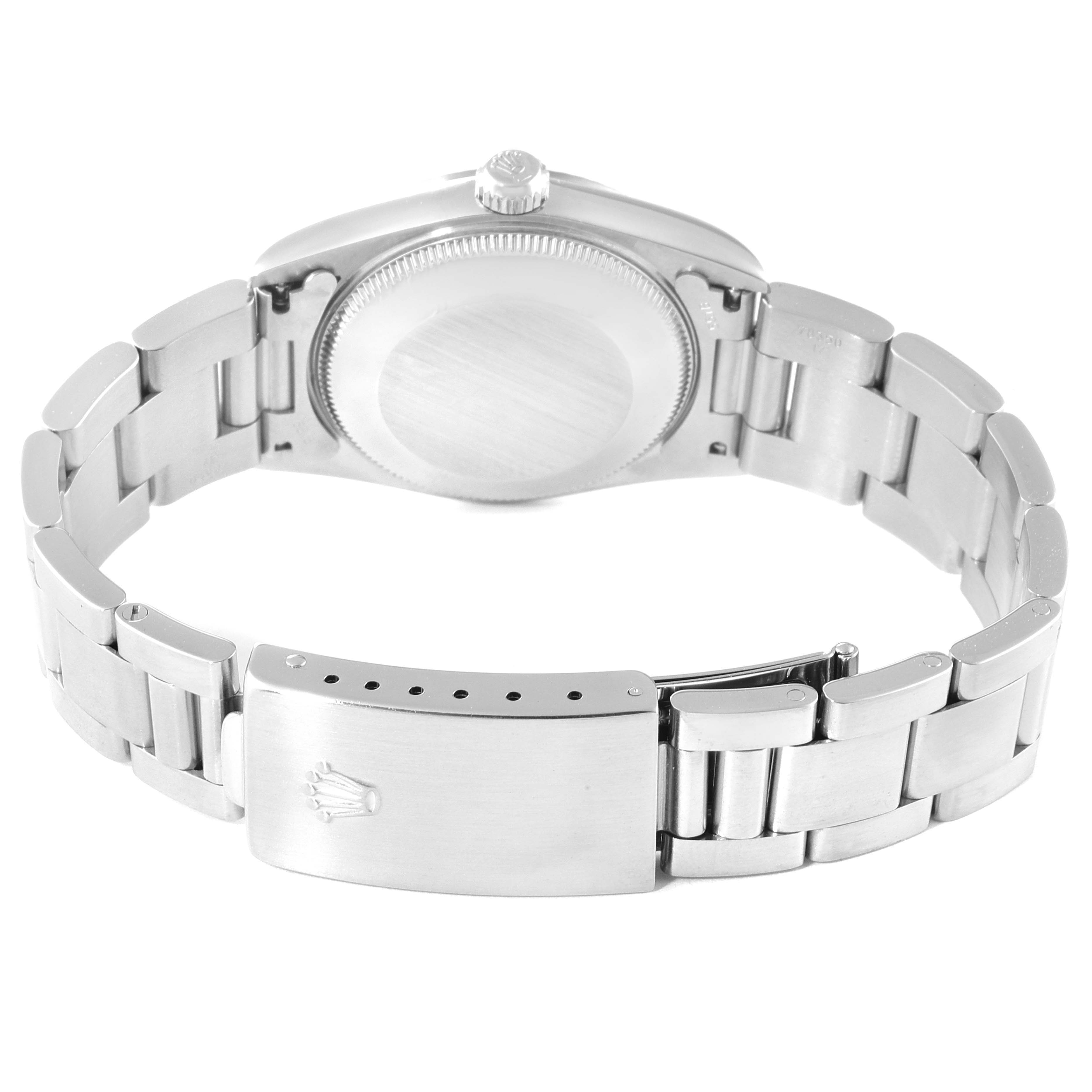 This image shows the back and bracelet clasp of the mid-size Rolex watch.