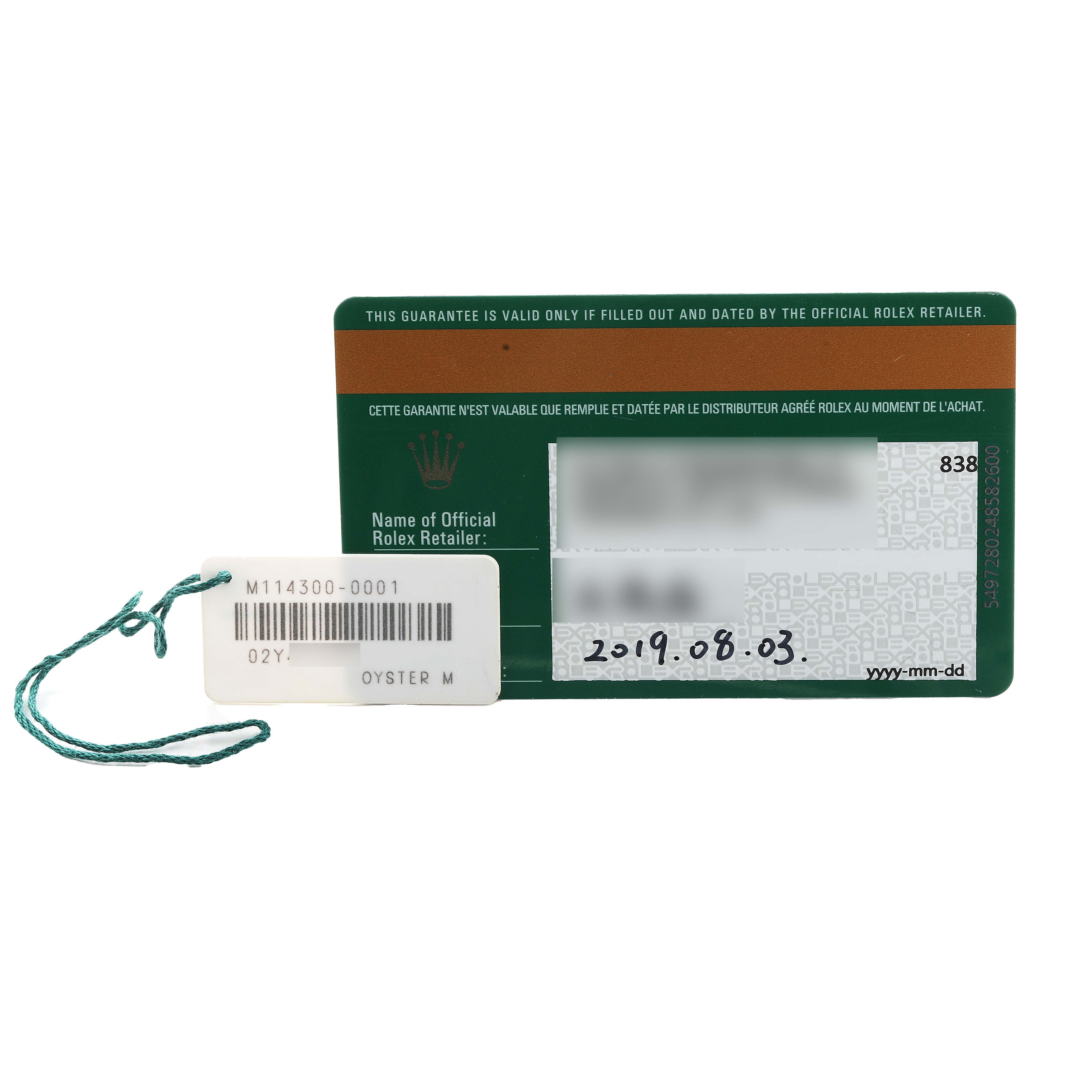 The image shows a warranty card and hangtag for a Rolex Oyster Perpetual 114300 Men's Stainless Steel Grey Dial watch.