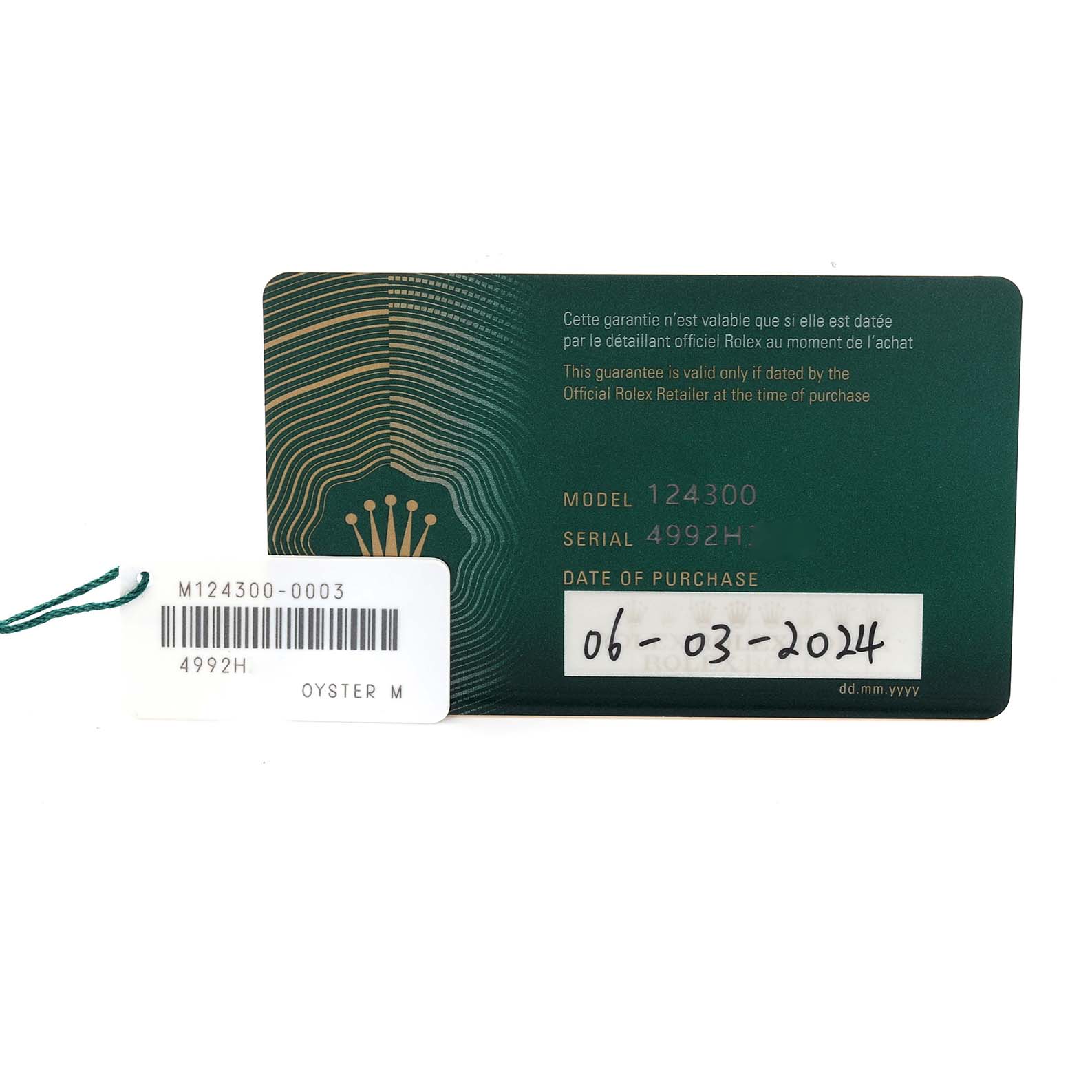 The image shows warranty cards and tags for a Rolex Oyster Perpetual 124300 Men's Stainless Steel Blue Dial 124300 Men's Stainless Steel Blue Dial, model 124300.