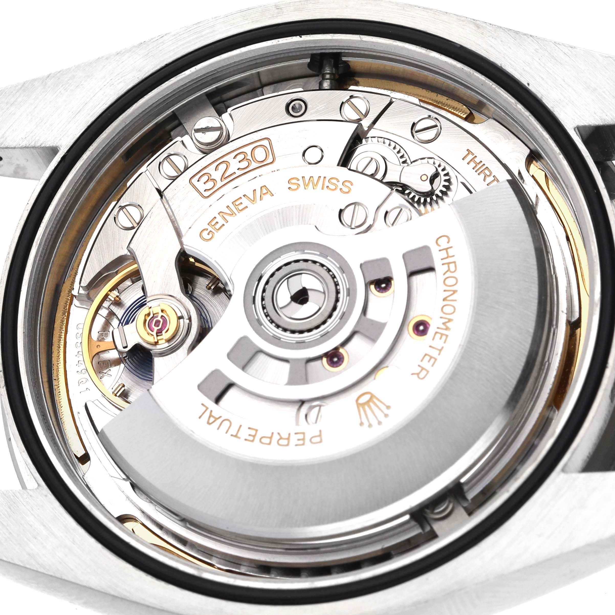 The image shows the Rolex Oyster Perpetual 124300 Men's Stainless Steel Blue Dial 124300 Men's Stainless Steel Blue Dial's movement from the back, highlighting the rotor and intricate Swiss components.