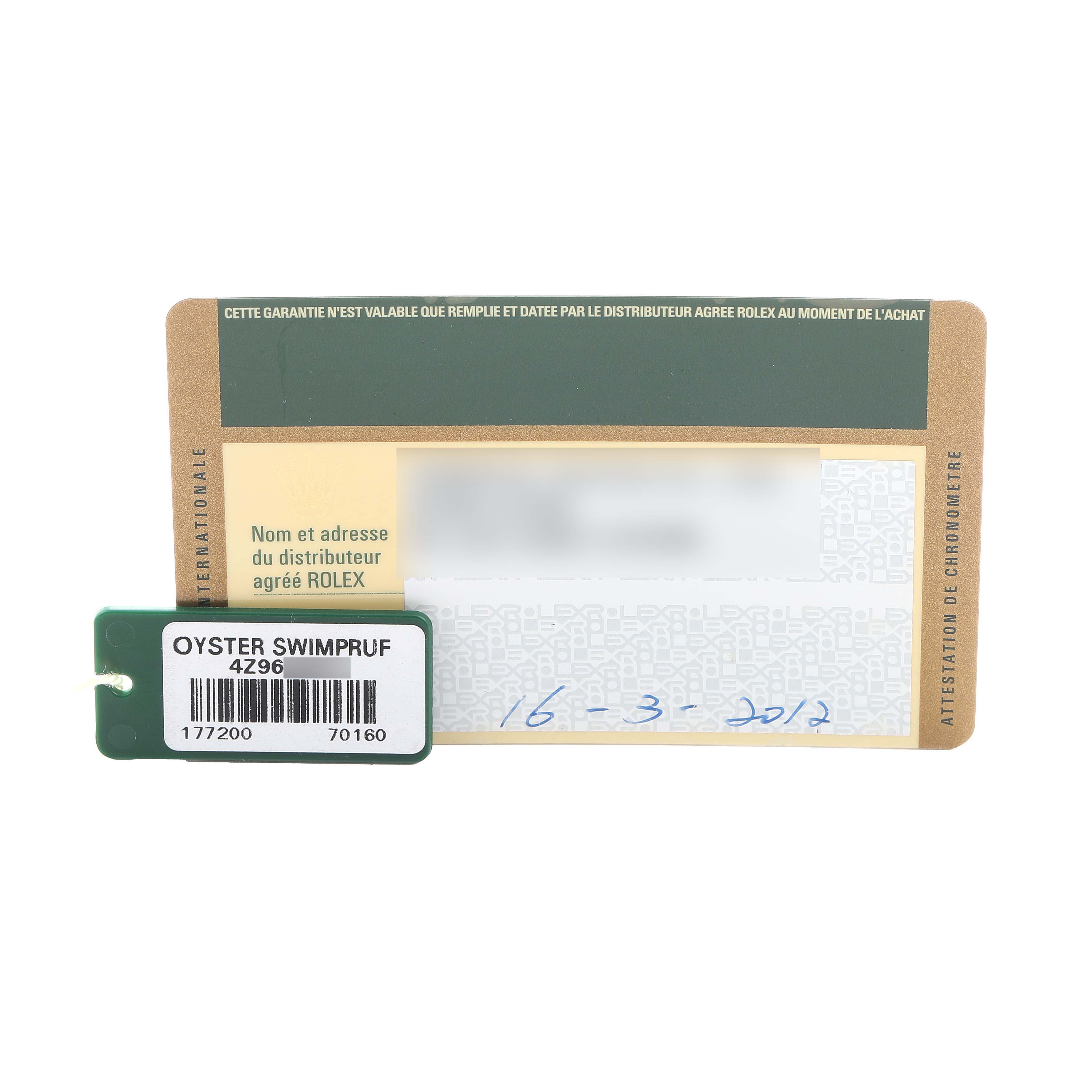 The image shows a warranty card and tag for a mid-size Rolex watch, not the watch itself.