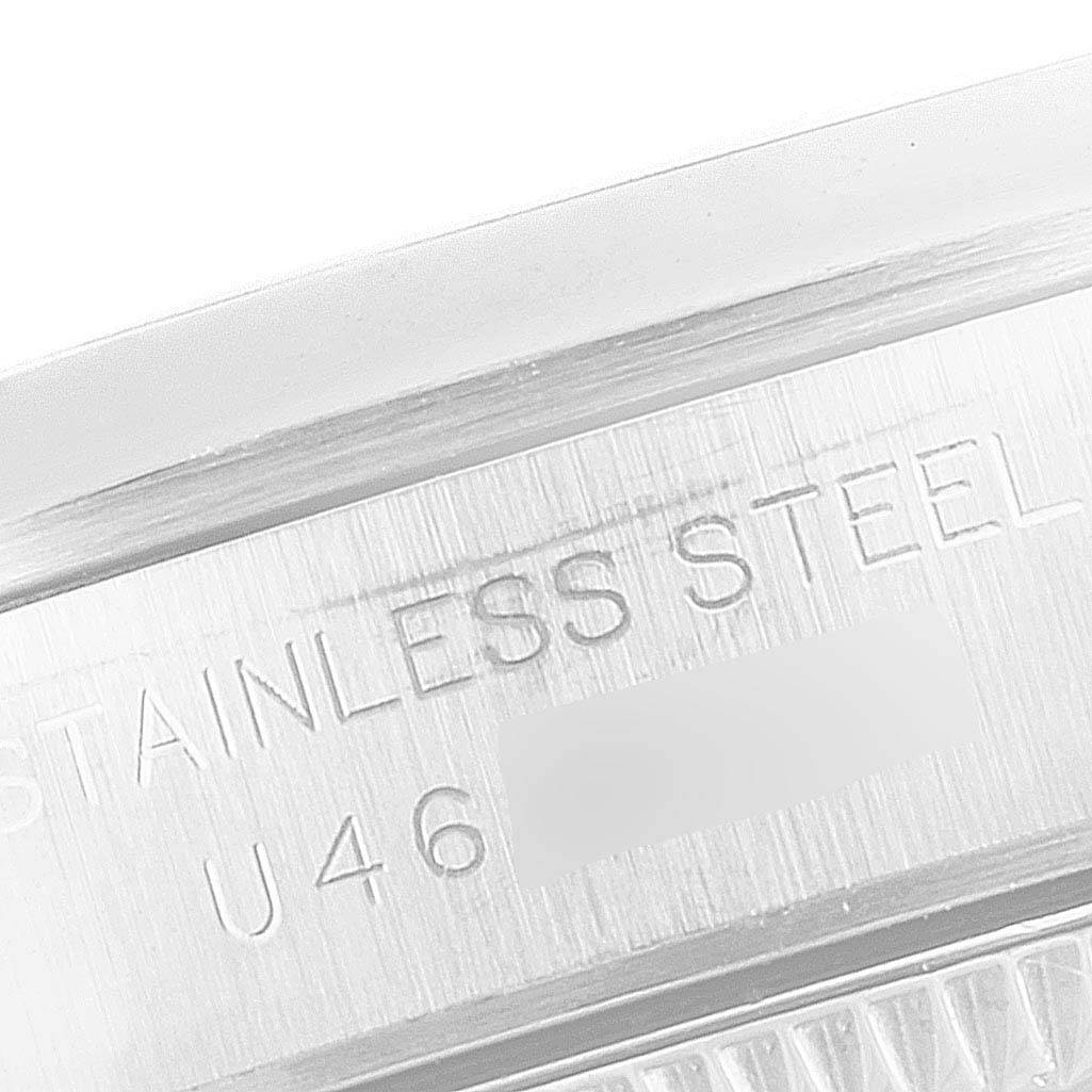 The image shows a close-up of the case back of a Rolex Oyster Perpetual 67180 Women's Stainless Steel Pink Dial 67180 Women's Stainless Steel Pink Dial watch, highlighting the stainless steel engraving.