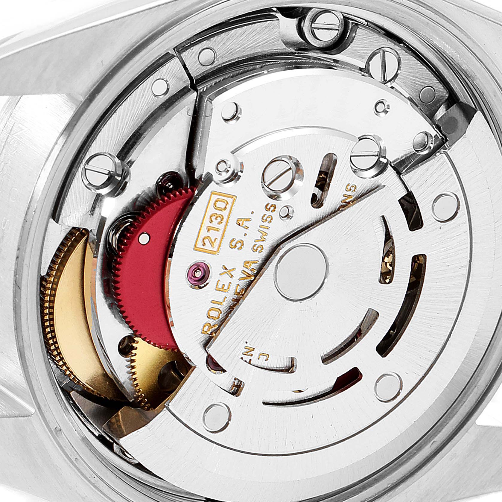 This image shows a close-up of the movement inside a Rolex Oyster Perpetual 67180 Women's Stainless Steel Pink Dial 67180 Women's Stainless Steel Pink Dial watch from the back.