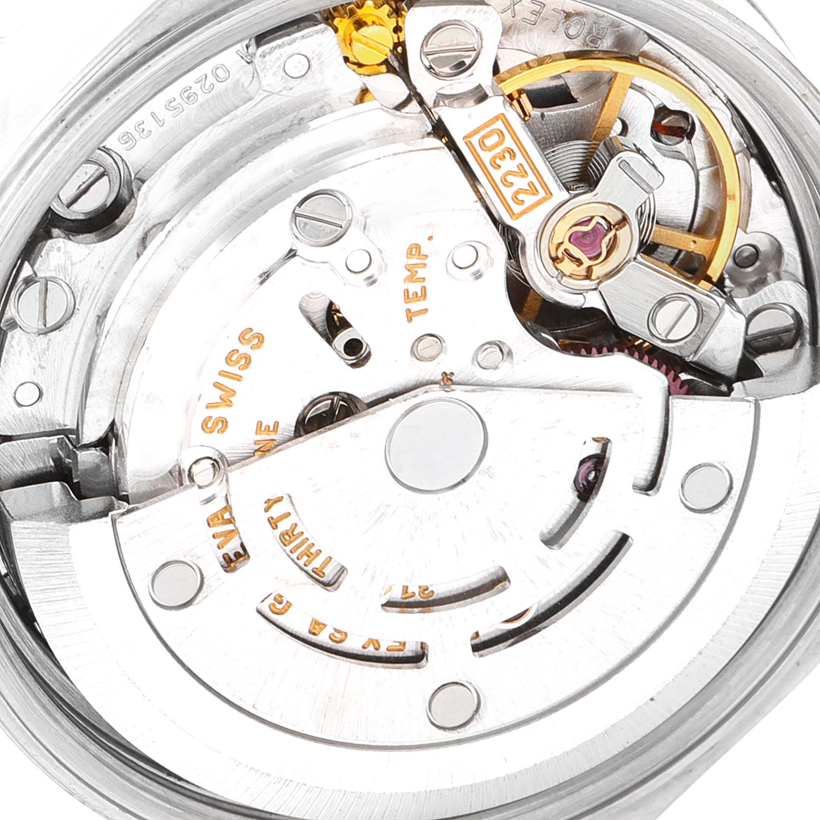 The image shows a close-up of the movement mechanism of a Rolex Oyster Perpetual 76030 Women
s Stainless Steel Blue Dial 76030 Women
s Stainless Steel Blue Dial watch, featuring the rotor and balance wheel.