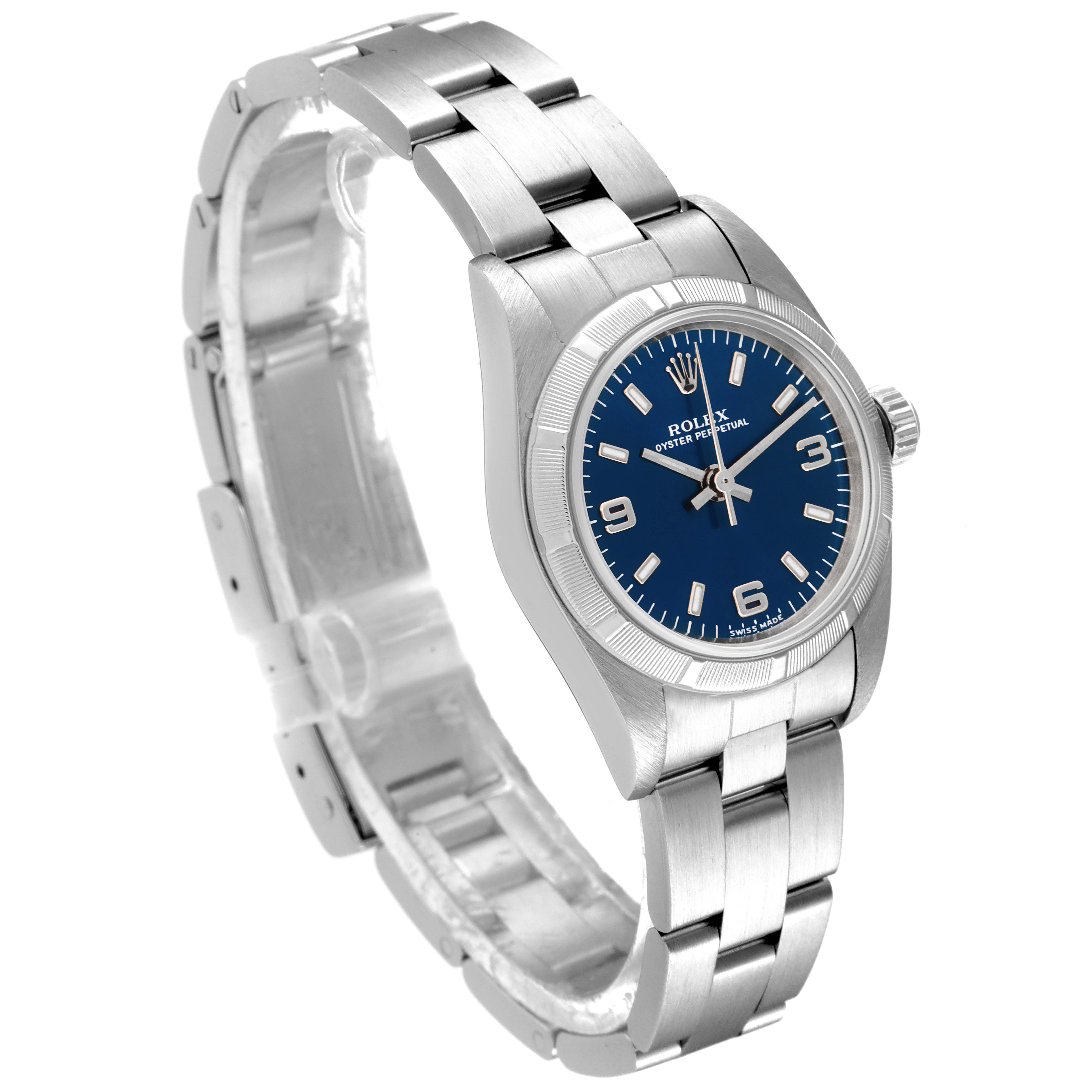The image shows a Rolex Oyster Perpetual 76030 Women
s Stainless Steel Blue Dial 76030 Women
s Stainless Steel Blue Dial model watch from an angled side view, highlighting the face, bracelet, and clasp.
