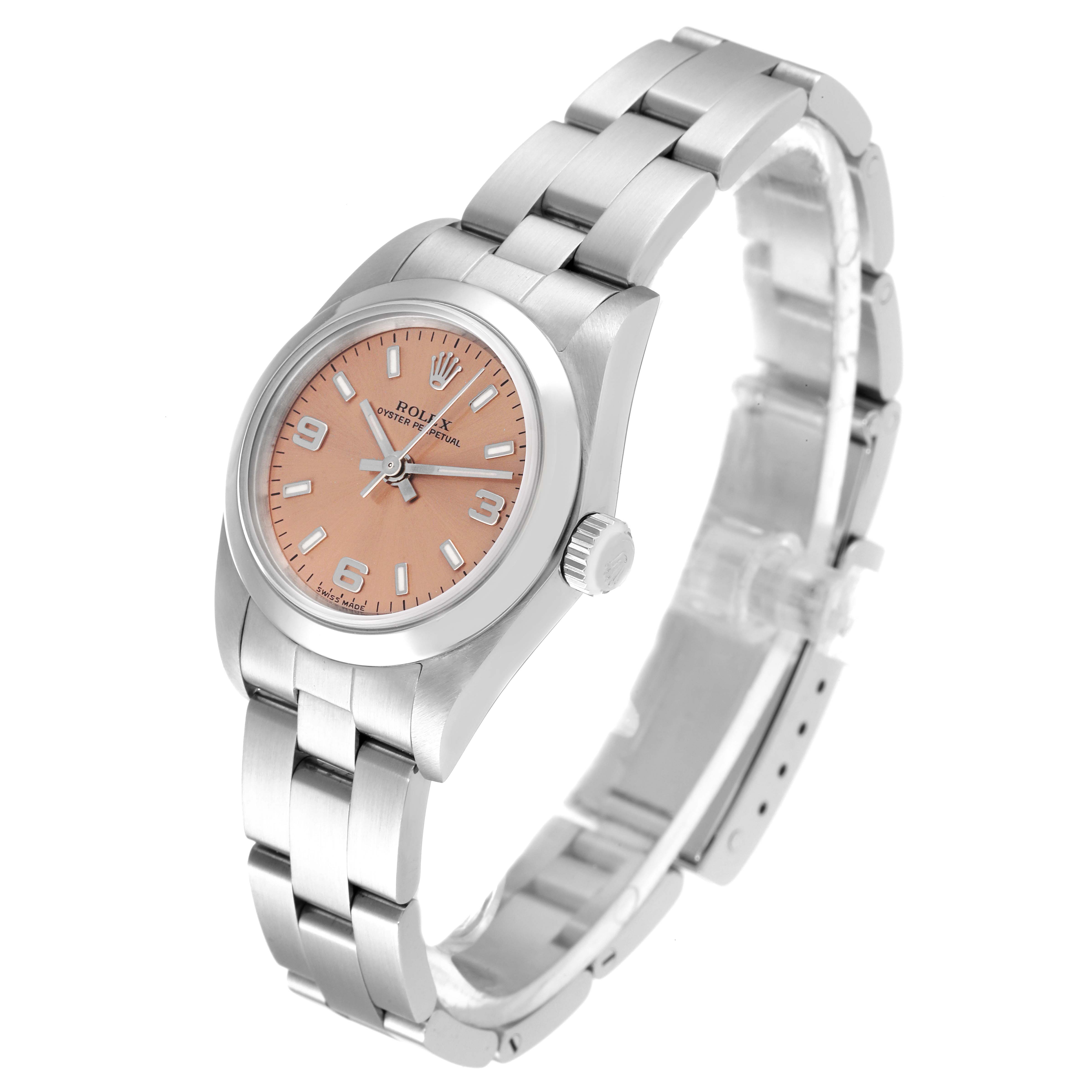 The Rolex Oyster Perpetual 76080 Women
s Stainless Steel Pink Dial 76080 Women
s Stainless Steel Pink Dial watch is shown at a three-quarter angle, displaying its dial, case, and bracelet.