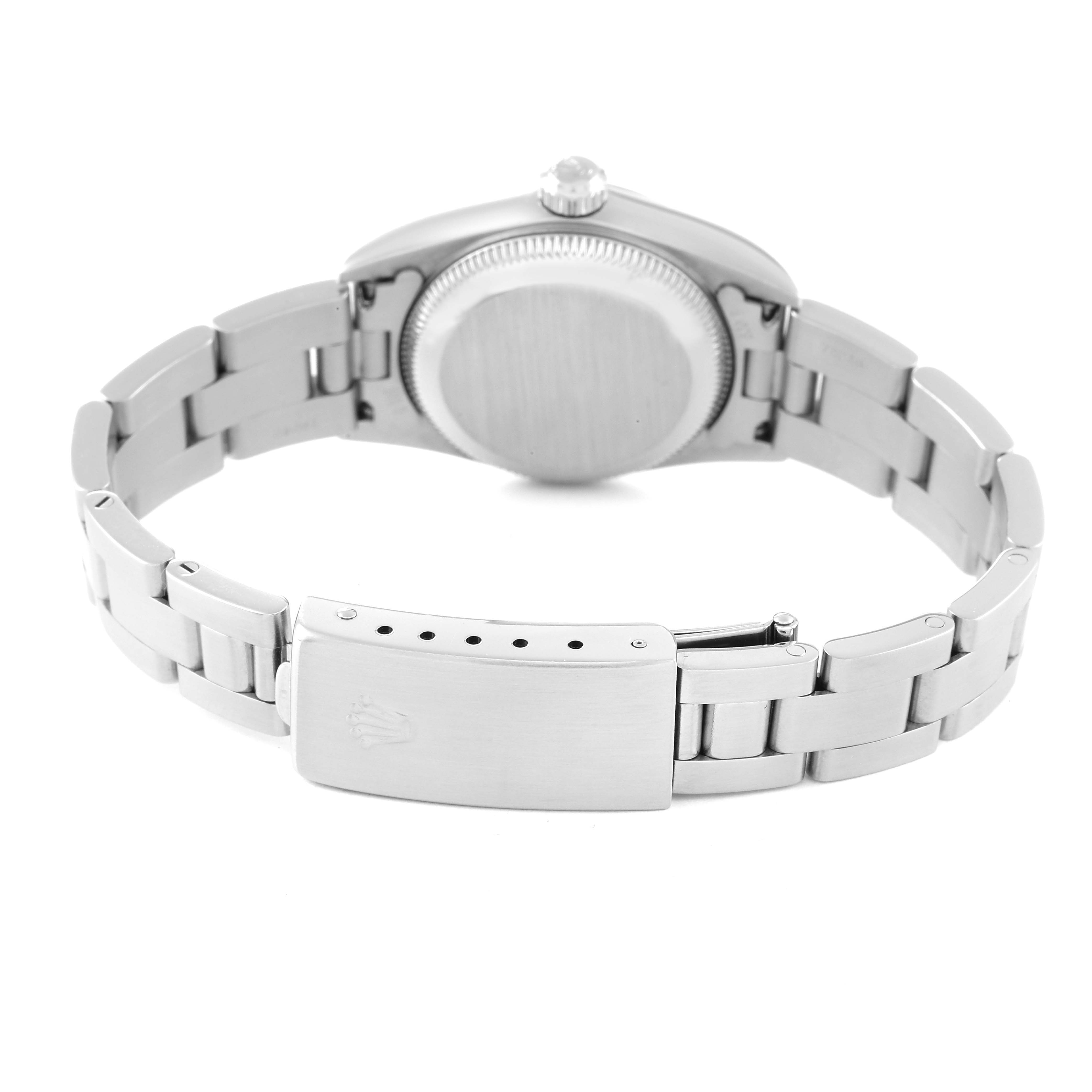 The image shows the back of a Rolex Oyster Perpetual 76080 Women
s Stainless Steel Pink Dial 76080 Women
s Stainless Steel Pink Dial watch, including its case back, bezel, and bracelet clasp.