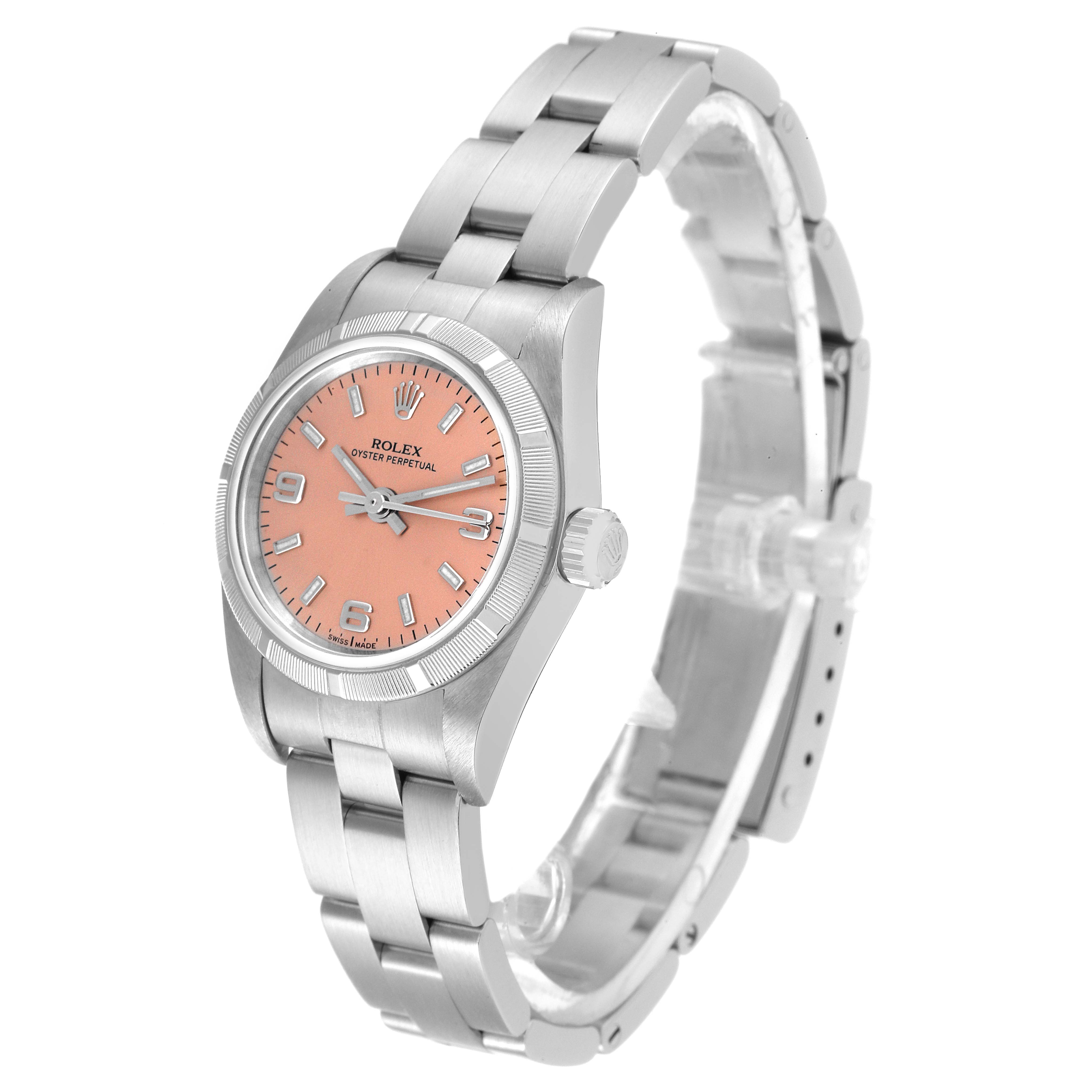 The image shows a Rolex Oyster Perpetual 76030 Women
s Stainless Steel Pink Dial 76030 Women
s Stainless Steel Pink Dial watch at a three-quarter angle, highlighting its pink dial, bezel, crown, and stainless steel bracelet.