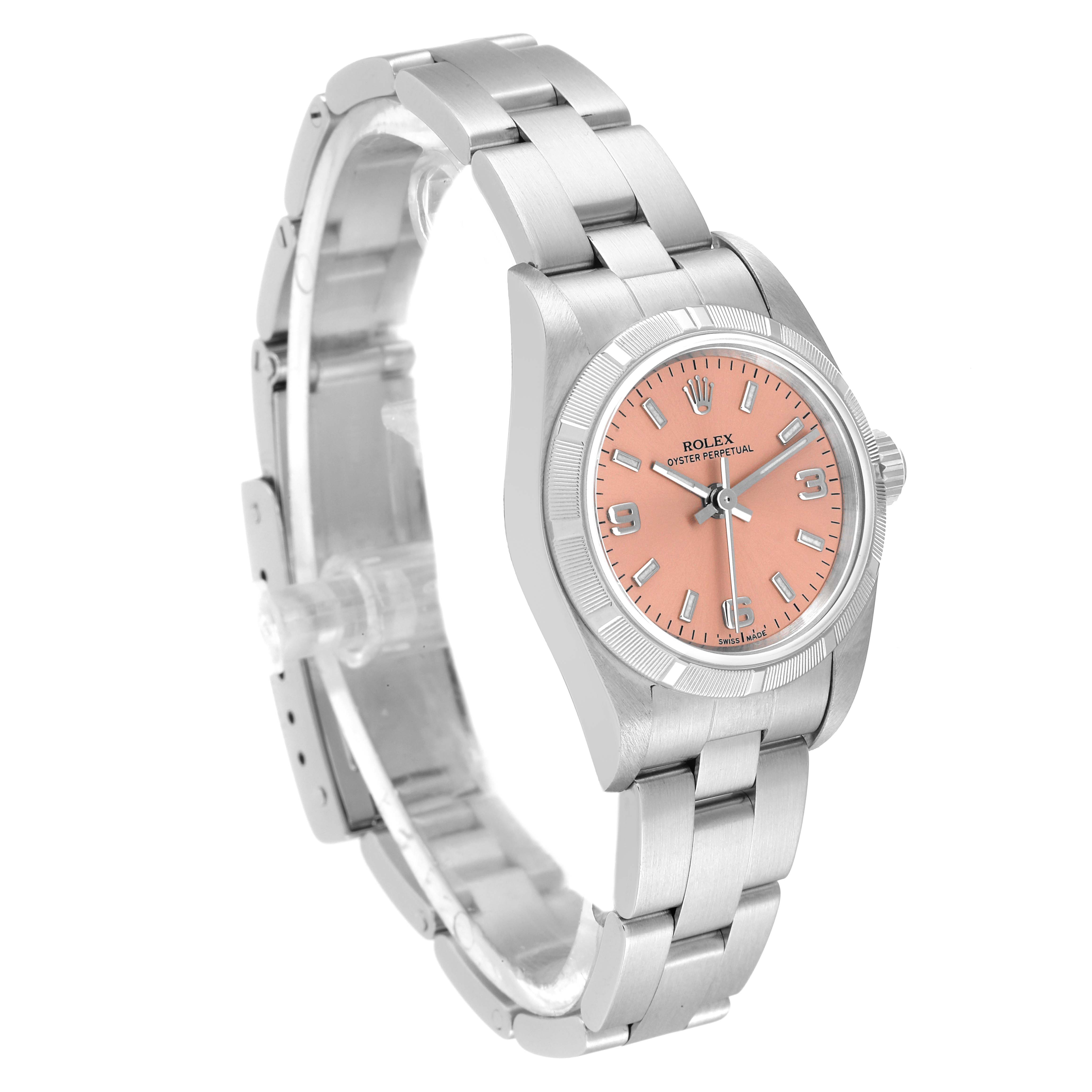 The image shows a side and front angle of the Rolex Oyster Perpetual 76030 Women
s Stainless Steel Pink Dial 76030 Women
s Stainless Steel Pink Dial watch with a salmon-pink dial and stainless steel bracelet.