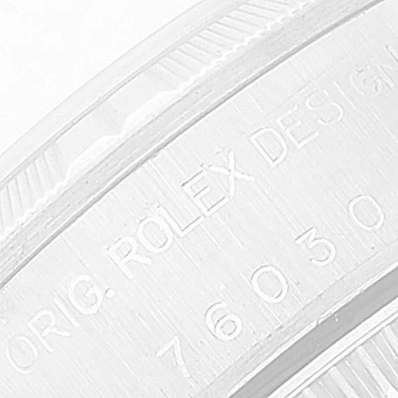 This close-up image shows the engraved side of the bezel of a Rolex Oyster Perpetual 76030 Women
s Stainless Steel Pink Dial 76030 Women
s Stainless Steel Pink Dial watch.