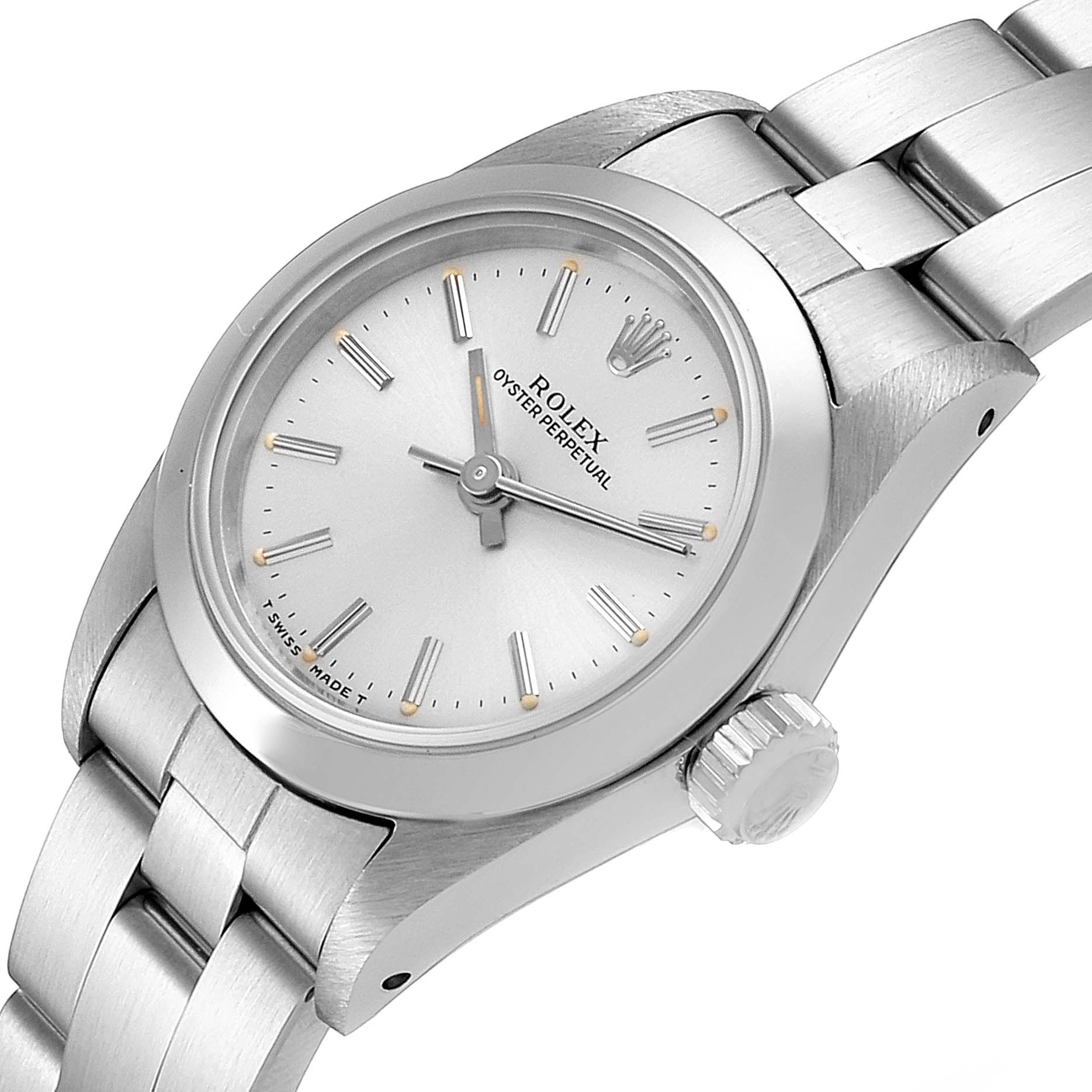 This image shows a Rolex Oyster Perpetual 67180 Women's Stainless Steel Silver Dial 67180 Women's Stainless Steel Silver Dial watch from a three-quarter angle, highlighting the face, crown, and bracelet.