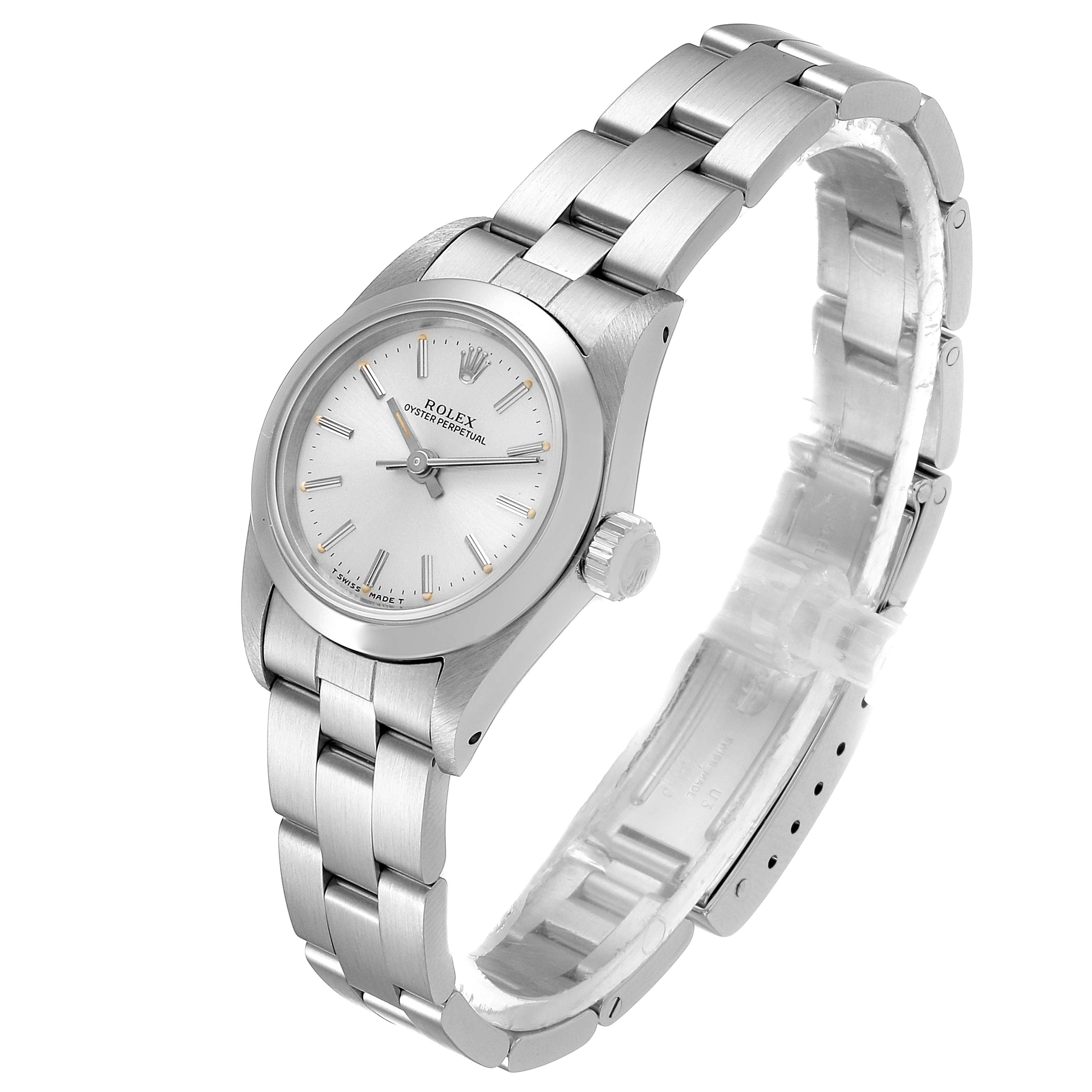 This image shows a side angle of a Rolex Oyster Perpetual 67180 Women's Stainless Steel Silver Dial 67180 Women's Stainless Steel Silver Dial watch, featuring its dial, case, crown, and metal bracelet.