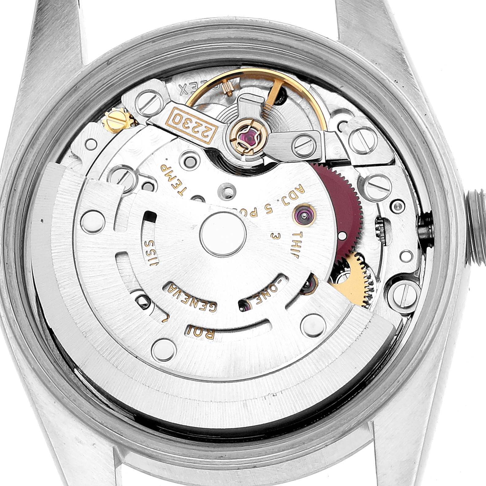 The image shows the back view of a Rolex Oyster Perpetual 76030 Women's Stainless Steel Black Dial's movement mechanism, highlighting gears and the rotor.