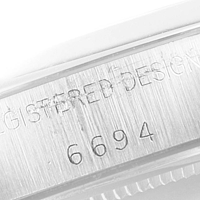 This image shows a close-up of the side of a Vintage Collection Rolex watch, displaying the model number 6694.