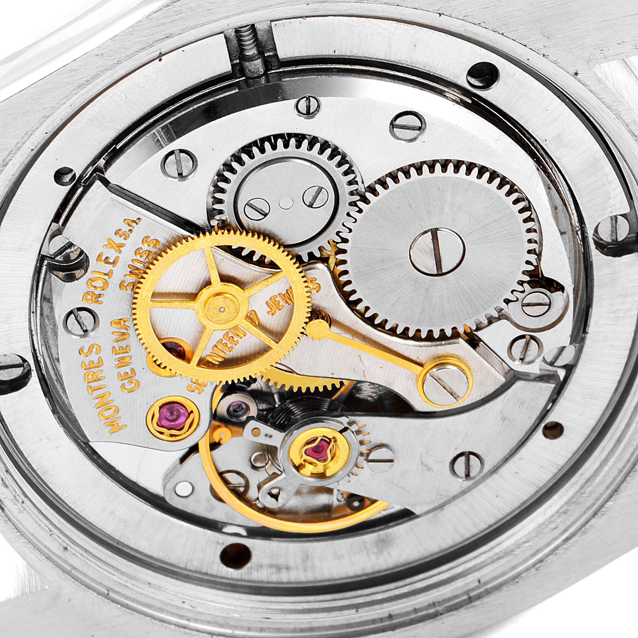 This close-up image of a Vintage Collection Rolex watch shows the intricate inner mechanisms and gears.