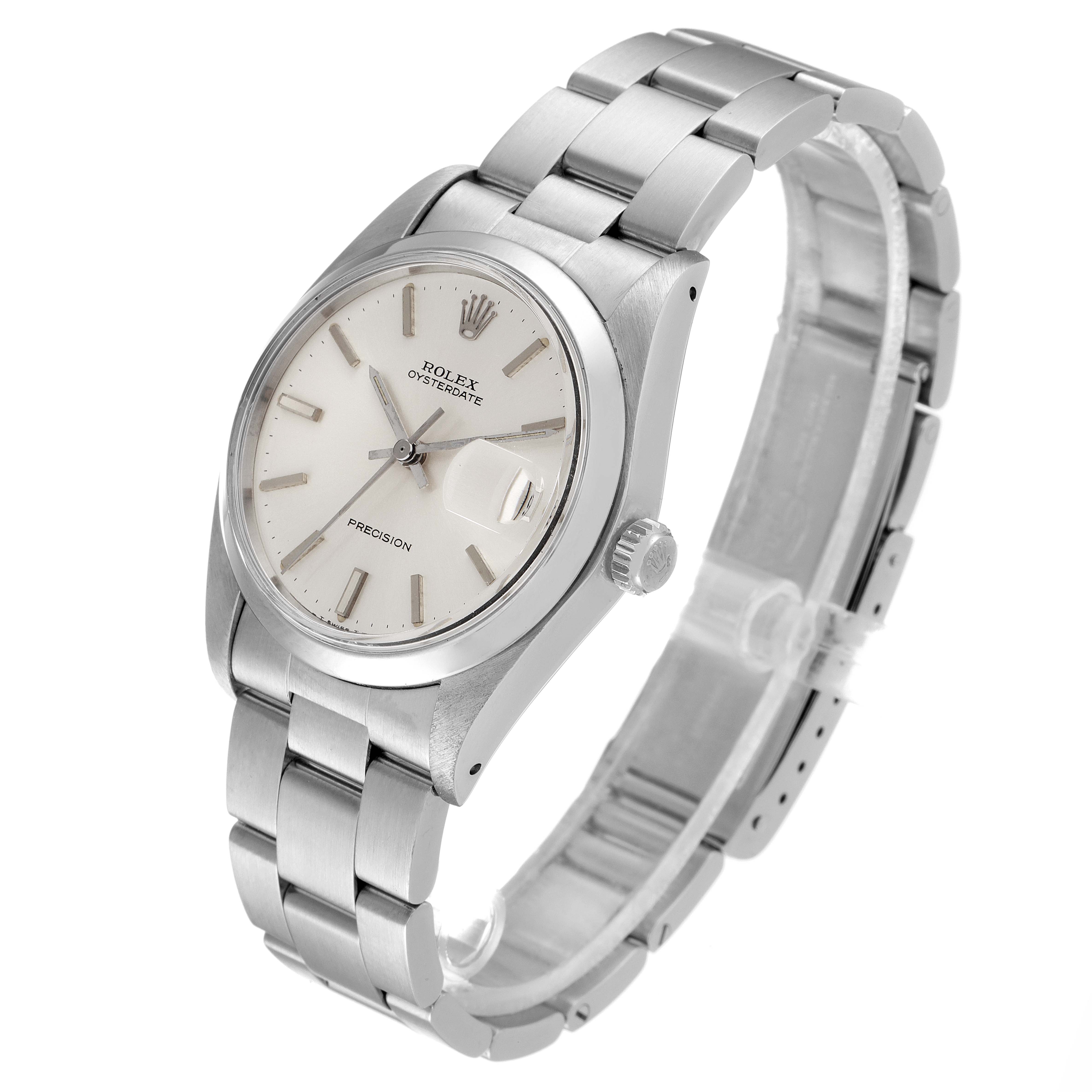 The image shows a Rolex Vintage Collection 6694 Men's Stainless Steel Silver Dial 6694 Men's Stainless Steel Silver Dial Oysterdate watch from an angled side view, highlighting the face, bezel, crown, and bracelet.