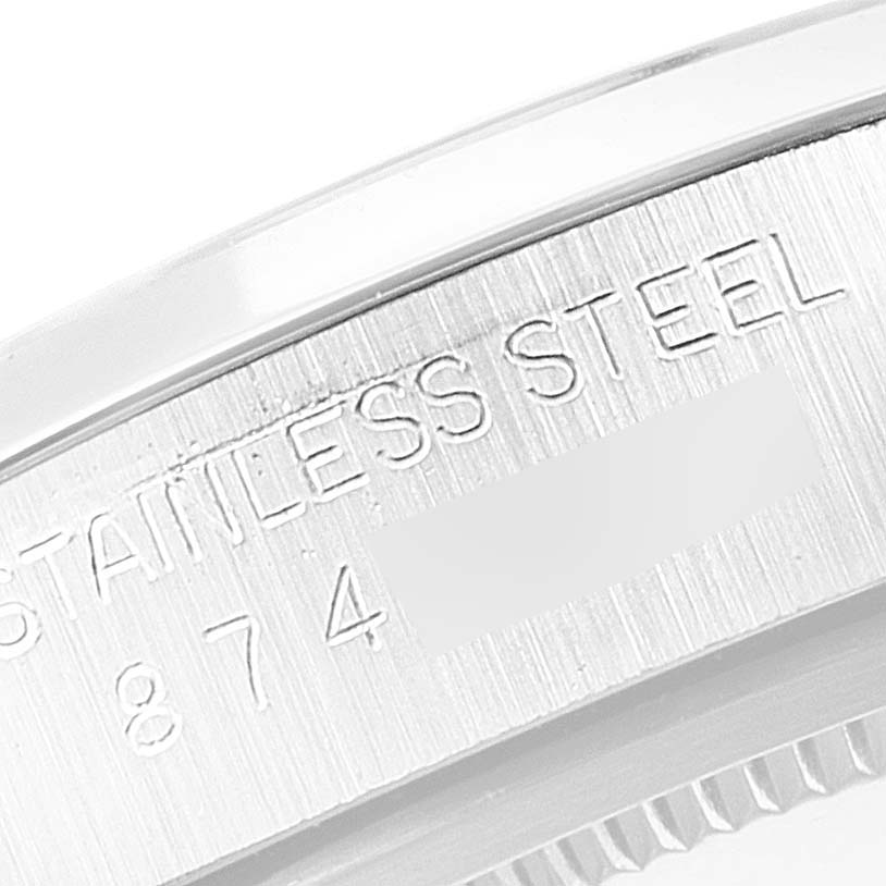 This close-up image shows the side engraving details of the Rolex Vintage Collection 6694 Men's Stainless Steel Silver Dial 6694 Men's Stainless Steel Silver Dial model watch, highlighting "STAINLESS STEEL" and partial numbers.