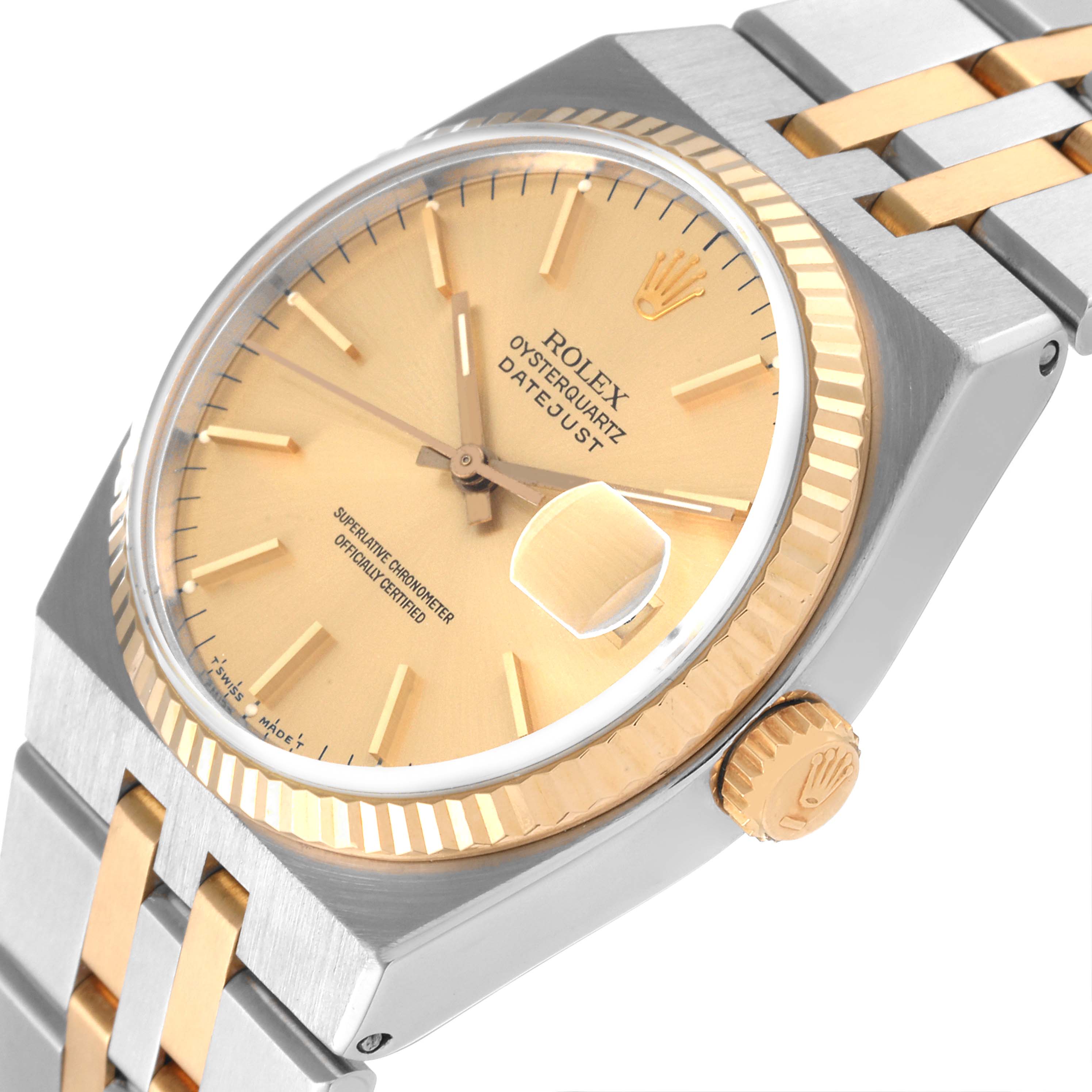 The image shows a close-up of a Rolex Oysterquartz 17013 Men's Steel and Gold (two tone) Champagne Dial 17013 Men's Steel and Gold (two tone) Champagne Dial Datejust watch face and part of its metal band at a slight angle.