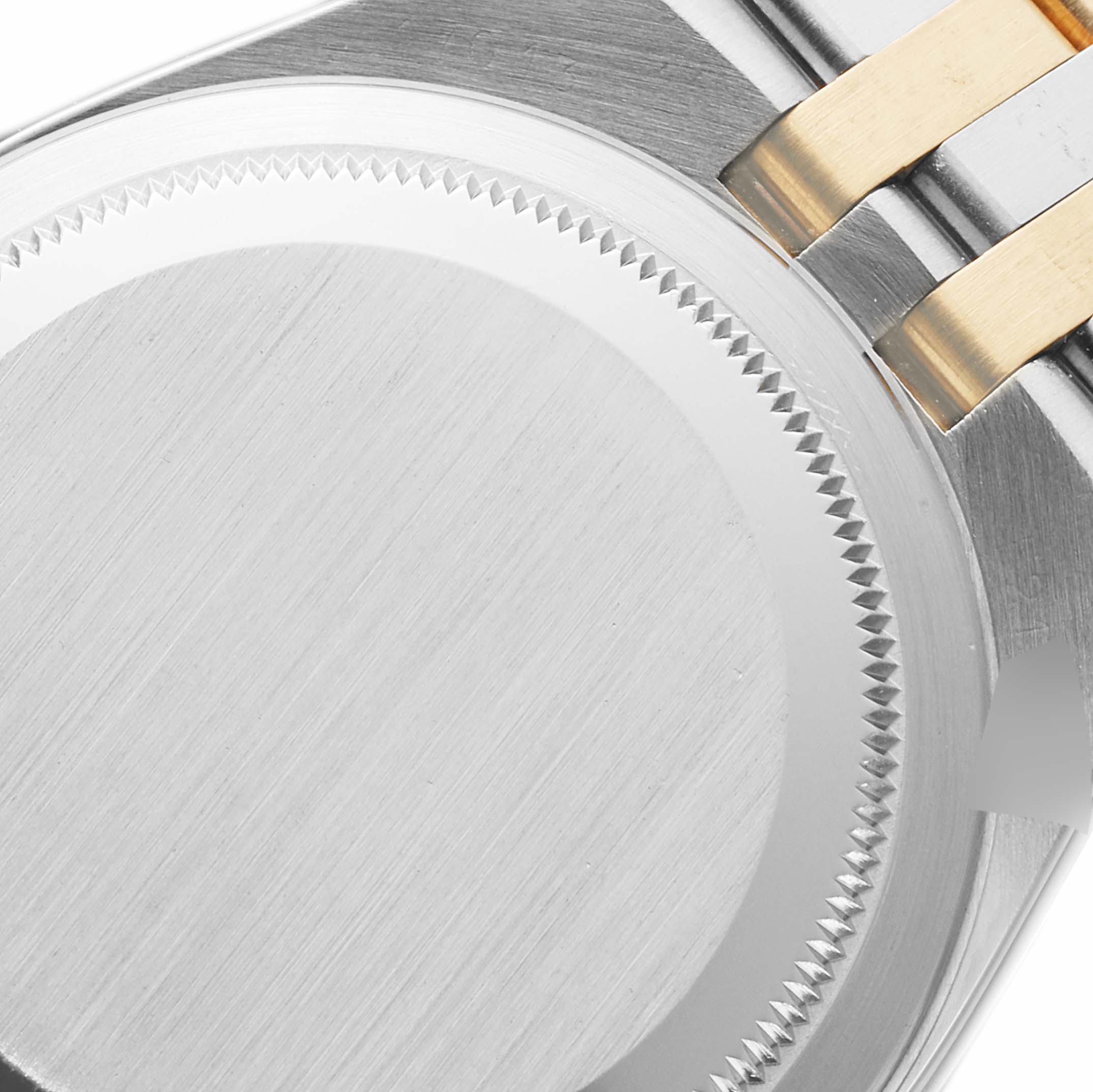 This image shows the back of a Rolex Oysterquartz 17013 Men's Steel and Gold (two tone) Champagne Dial 17013 Men's Steel and Gold (two tone) Champagne Dial watch including part of the case and bracelet.