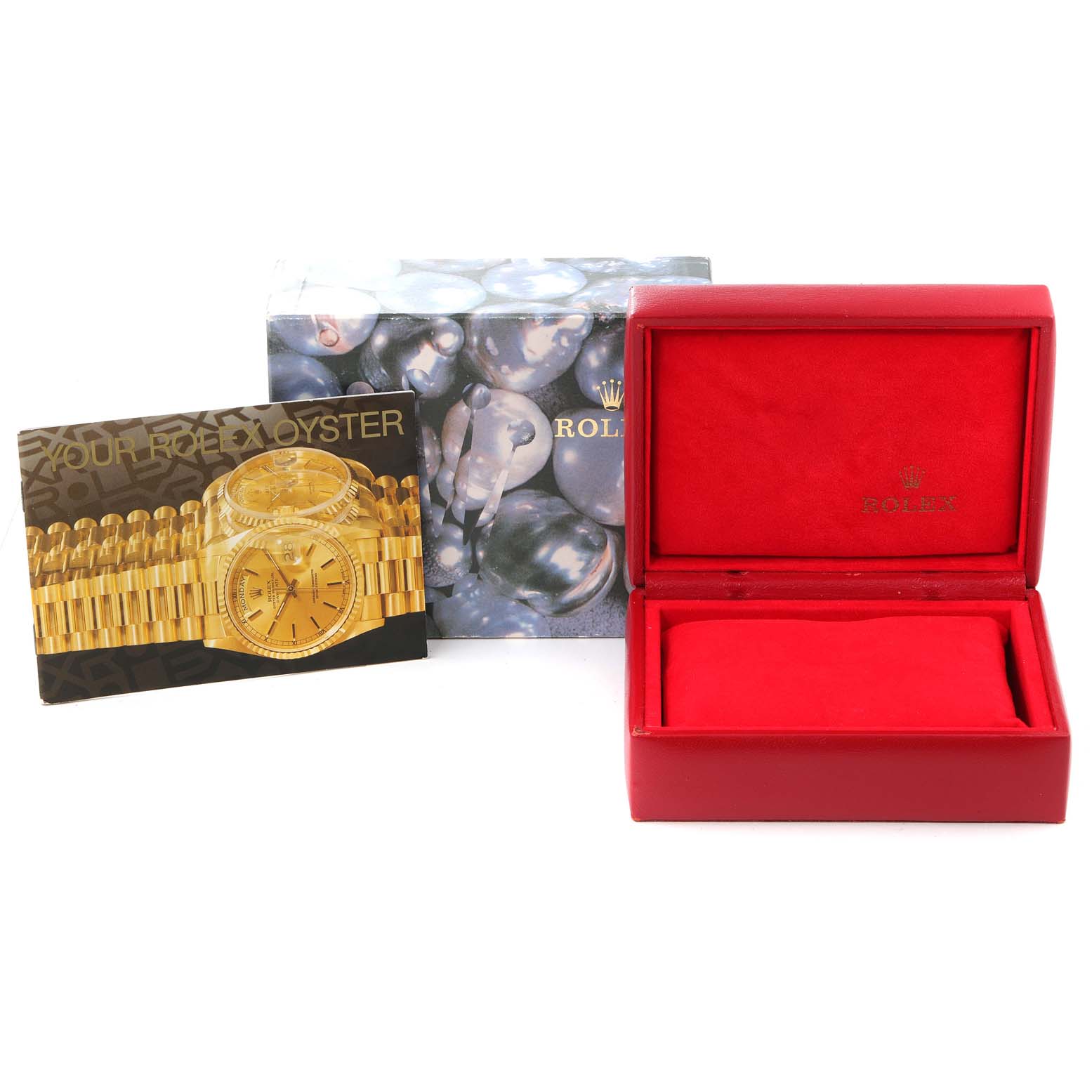 The image shows a Rolex President 69278 Women
s Yellow Gold White Dial 69278 Women
s Yellow Gold White Dial model watch box, a booklet, and an outer packaging sleeve at a straight-on angle.