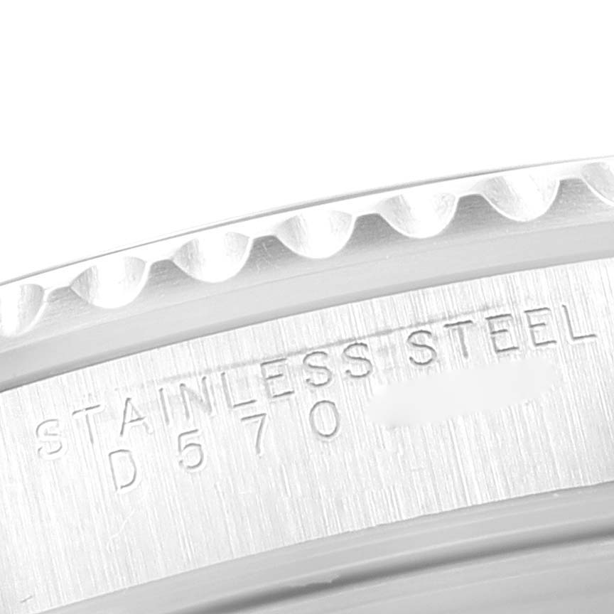 This close-up image shows the engraved stainless steel casing and part of the bezel of a Rolex Submariner 14060 Men
s Stainless Steel Black Dial 14060 Men
s Stainless Steel Black Dial watch.