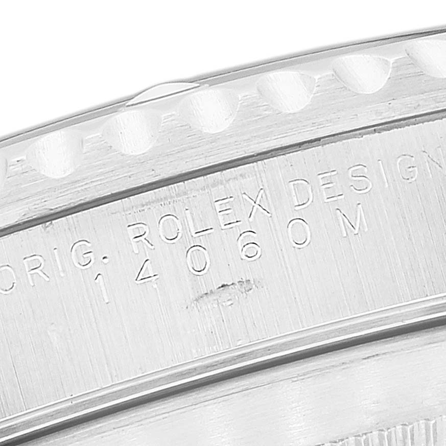 The image shows a close-up of the side of a Rolex Submariner 14060 Men
s Stainless Steel Black Dial 14060 Men
s Stainless Steel Black Dial watch case, highlighting the engraved model number 14060M.