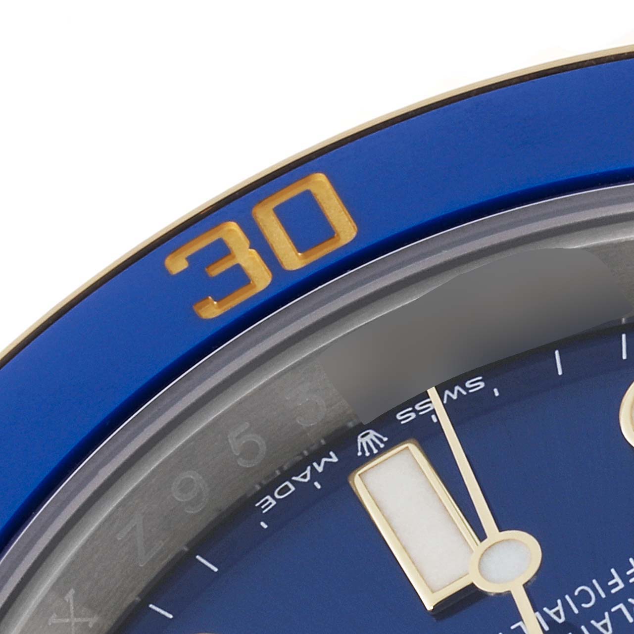 This is a close-up of the Rolex Submariner 126613 Men's Steel and Gold (two tone) Blue Dial 126613 Men's Steel and Gold (two tone) Blue Dial watch, showing part of the bezel and the dial at an angle.