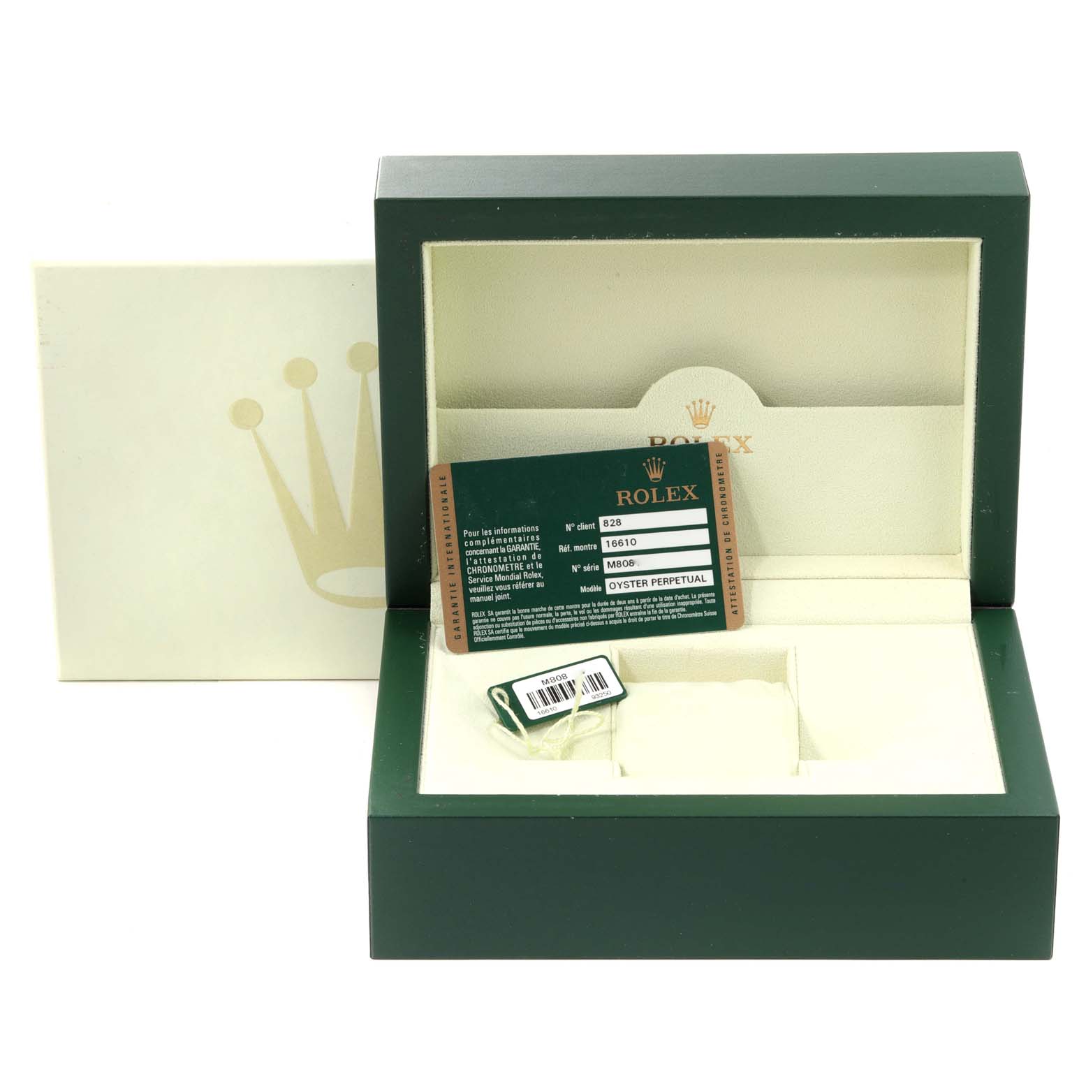 The image shows an open Rolex Submariner 16610 Men
s Stainless Steel Black Dial 16610 Men
s Stainless Steel Black Dial watch box with certification tag and the watch is not present.