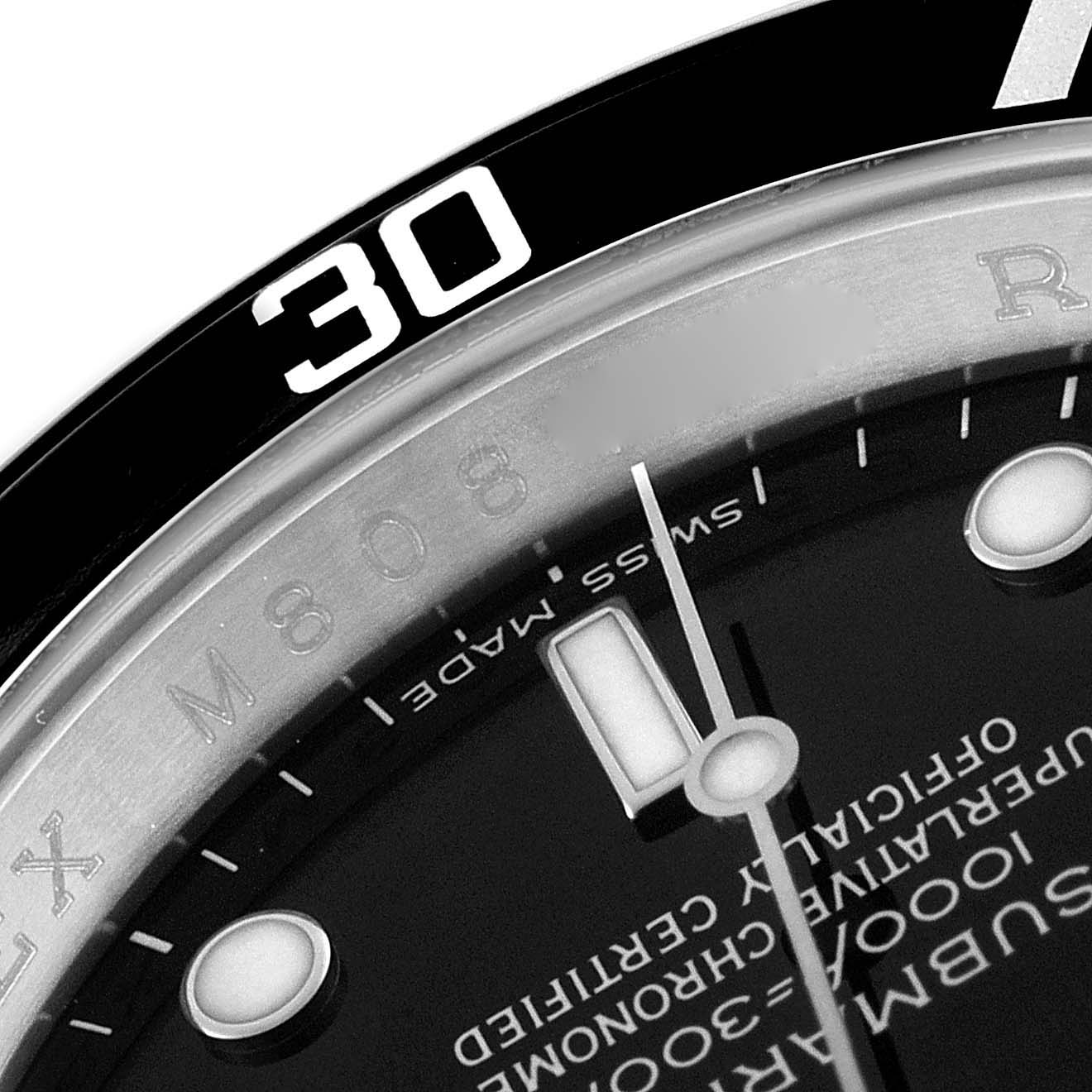 The image shows a close-up of the dial and bezel of a Rolex Submariner 16610 Men
s Stainless Steel Black Dial 16610 Men
s Stainless Steel Black Dial watch, focusing on the 30-minute mark.