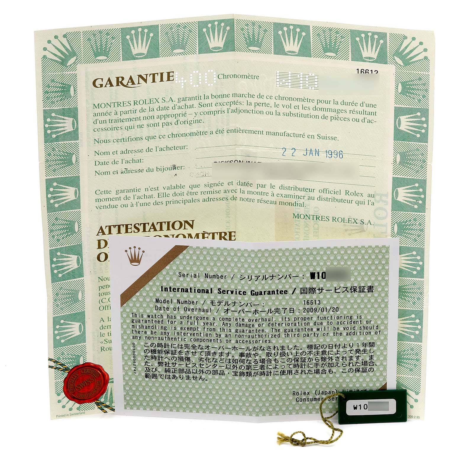 The image shows warranty documents and a tag for a Rolex Submariner 16613 Men's Steel and Gold (two tone) Blue Dial 16613 Men's Steel and Gold (two tone) Blue Dial watch.