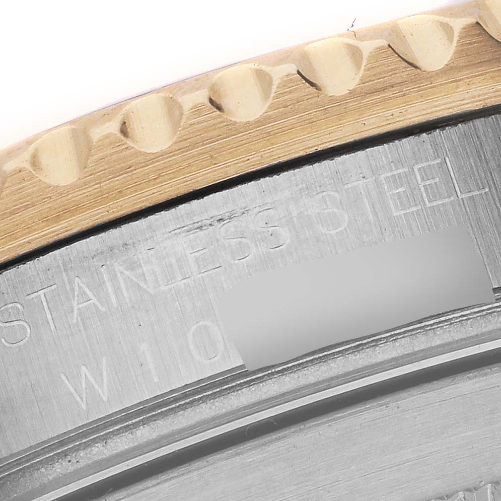 The image shows a close-up of the edge and markings on the case back of a Rolex Submariner 16613 Men's Steel and Gold (two tone) Blue Dial 16613 Men's Steel and Gold (two tone) Blue Dial.