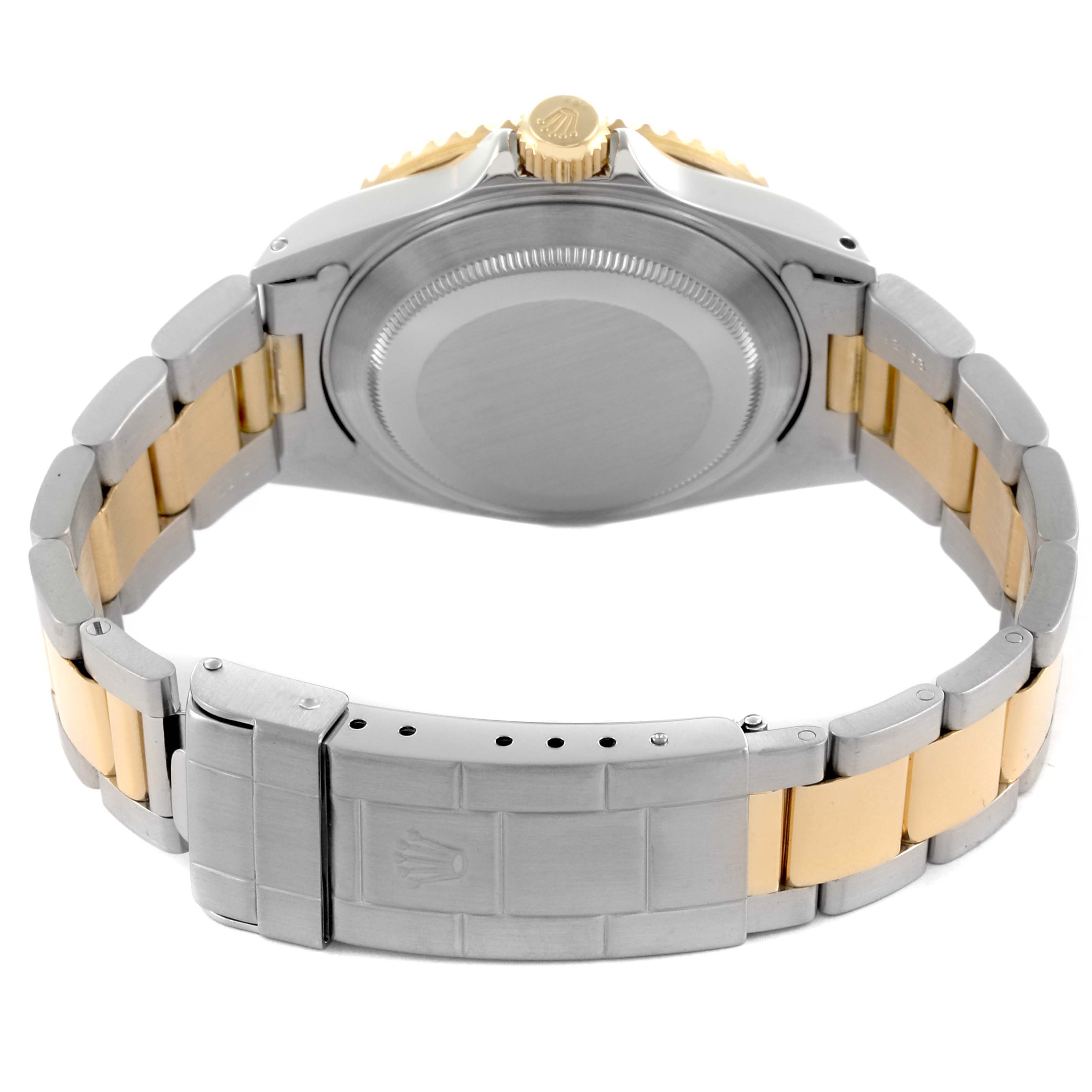 The image shows the back of the Rolex Submariner 16613 Men's Steel and Gold (two tone) Blue Dial 16613 Men's Steel and Gold (two tone) Blue Dial watch, highlighting the case back, bracelet, and clasp.