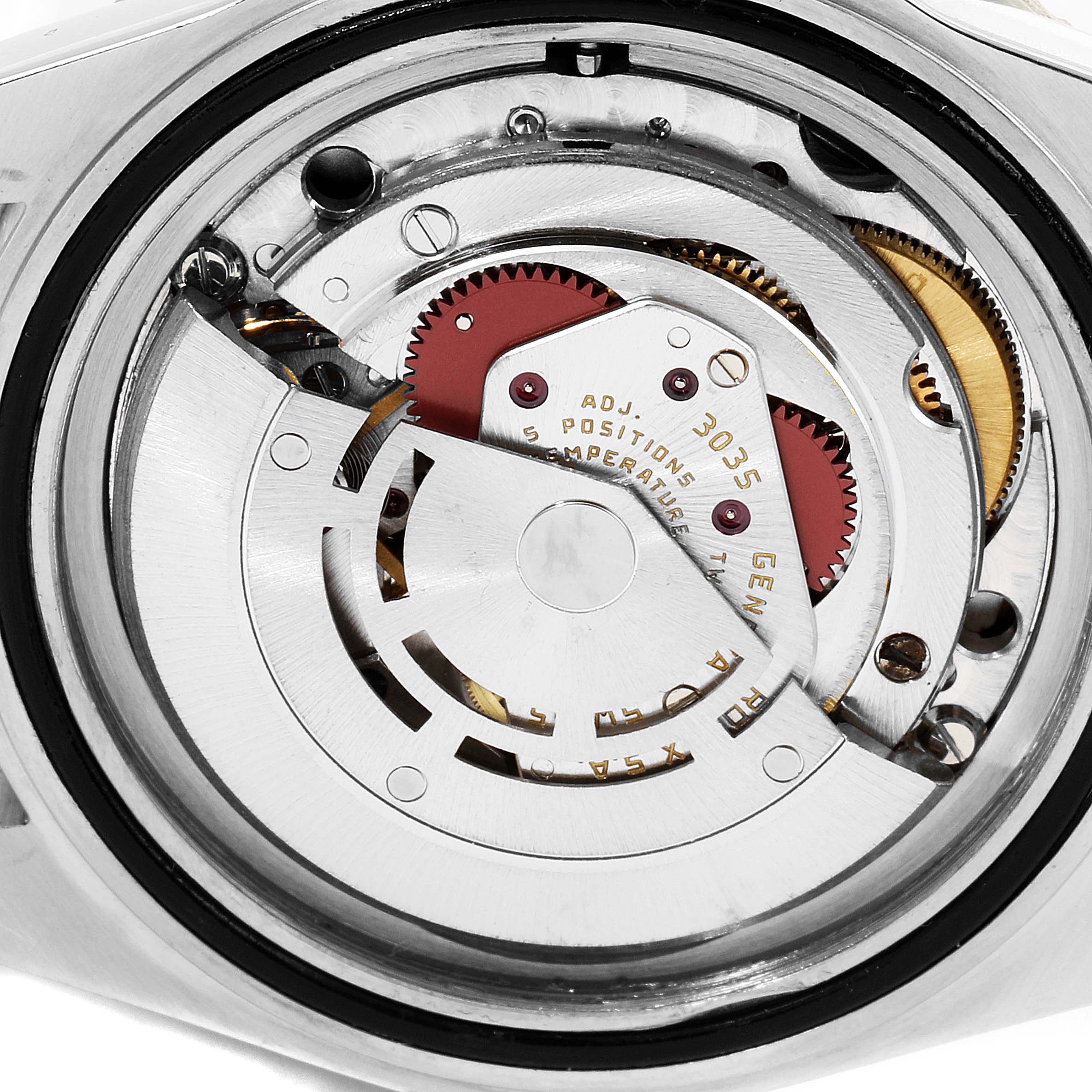 The image shows the movement mechanism of a Rolex Submariner 16803 Men's Steel and Gold (two tone) Black Dial 16803 Men's Steel and Gold (two tone) Black Dial watch from a rear angle.