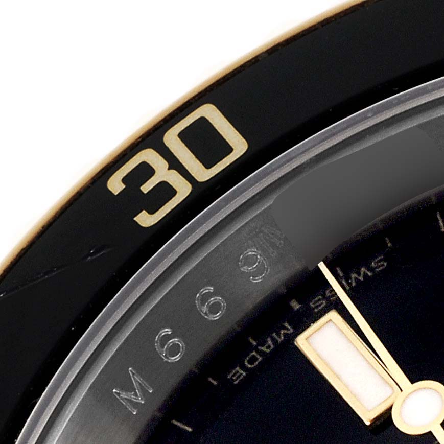 The image shows a close-up of the bezel and dial edge of a Rolex Submariner 16613 Men's Steel and Gold (two tone) Black Dial 16613 Men's Steel and Gold (two tone) Black Dial watch.